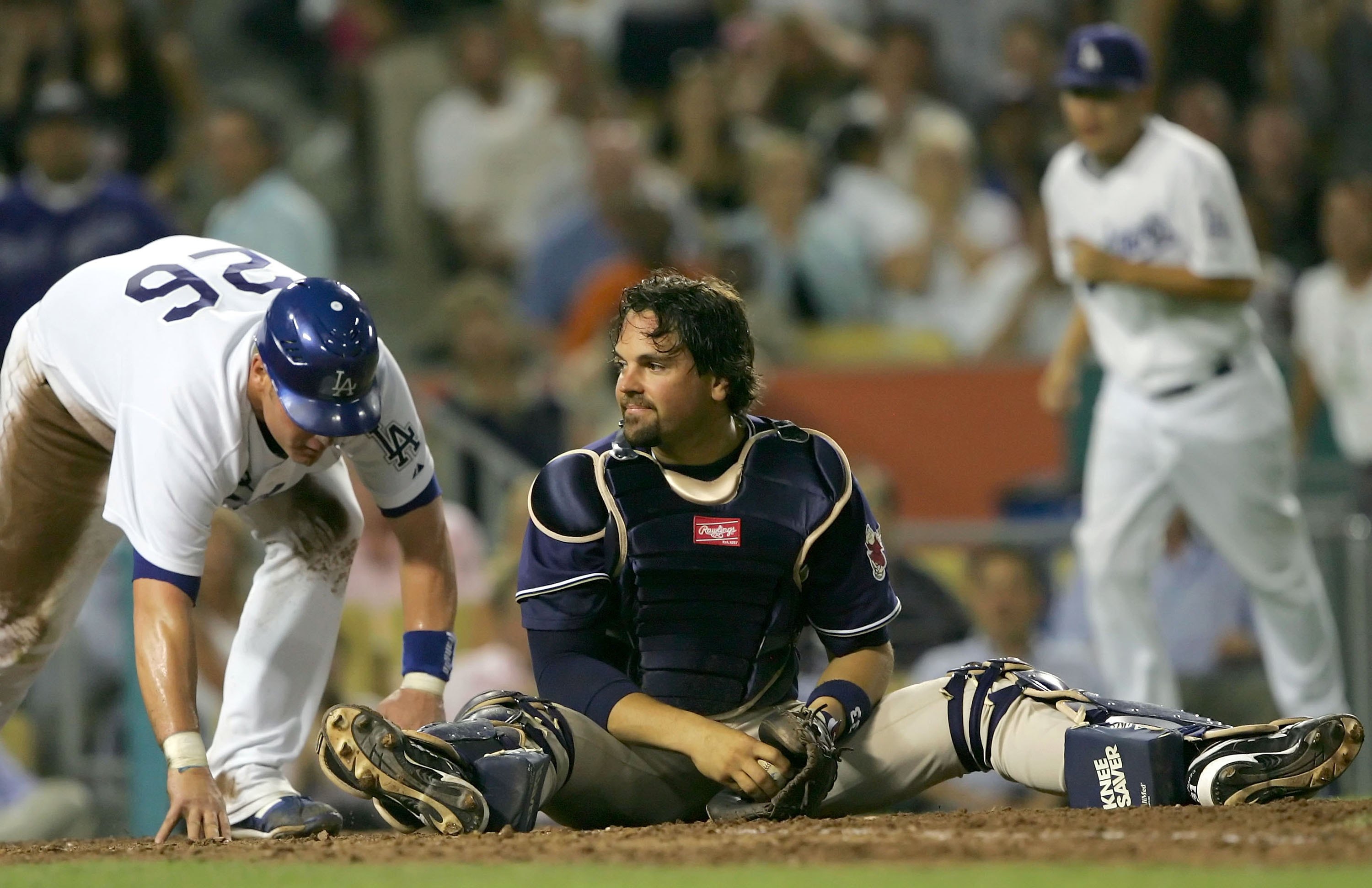 LOS ANGELES - JULY 25:  Mike Piazza #33 of the San Diego Padres sits on homeplate after tagging out Toby Hall #26 of the Los Angeles Dodgers in the sixth inning on July 25, 2006 at Dodger Stadium in Los Angeles, California.  (Photo by Lisa Blumenfeld/Gett