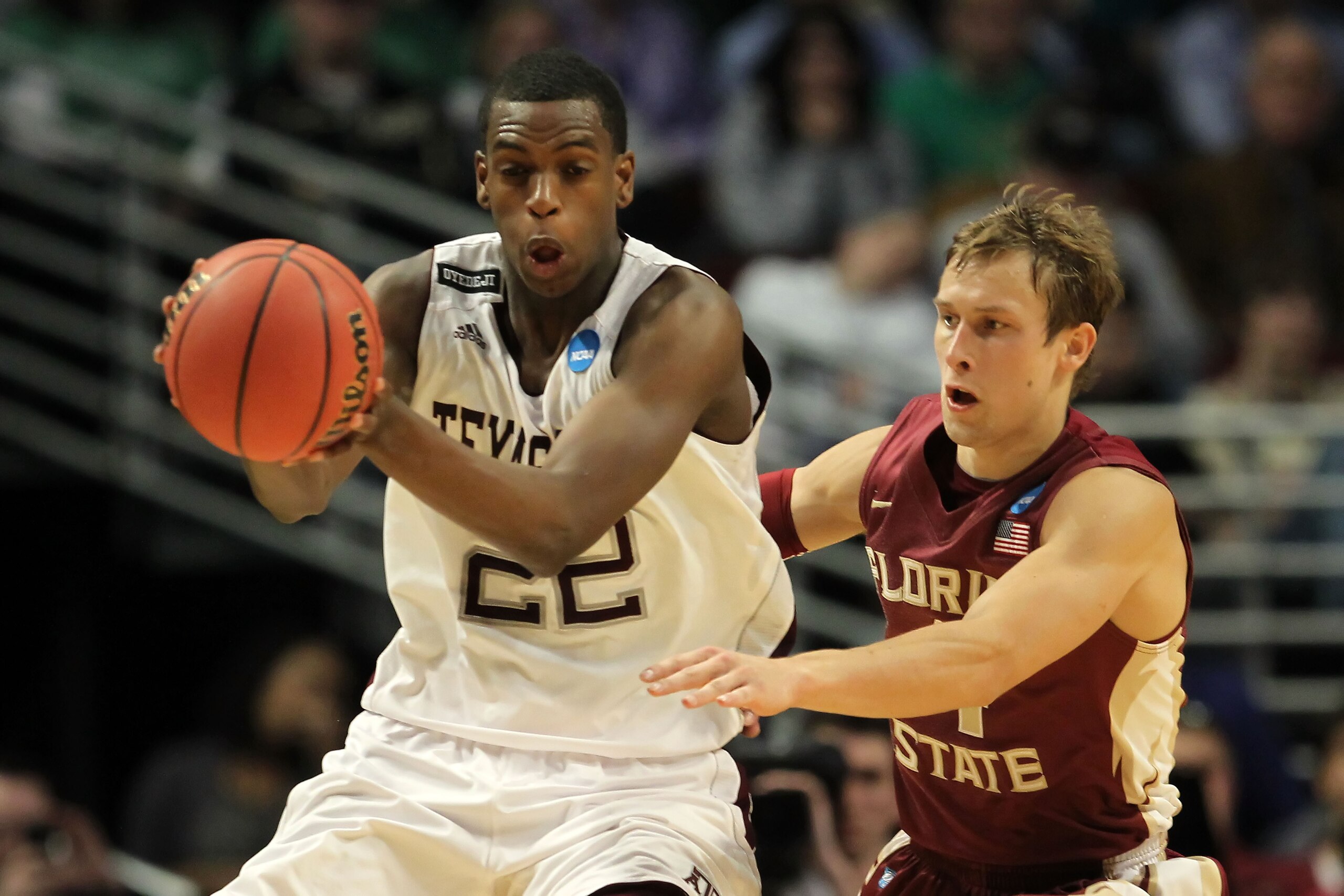 CHICAGO, IL - MARCH 18: Khris Middleton #22 of the Texas A&M Aggies controls the ball against Deividas Dulkys #4 of the Florida State Seminoles in the first half during the second round of the 2011 NCAA men's basketball tournament at the United Center on CHICAGO, IL - MARCH 18: Khris Middleton #22 of the Texas A&M Aggies controls the ball against Deividas Dulkys #4 of the Florida State Seminoles in the first half during the second round of the 2011 NCAA men's basketball tournament at the United Center on