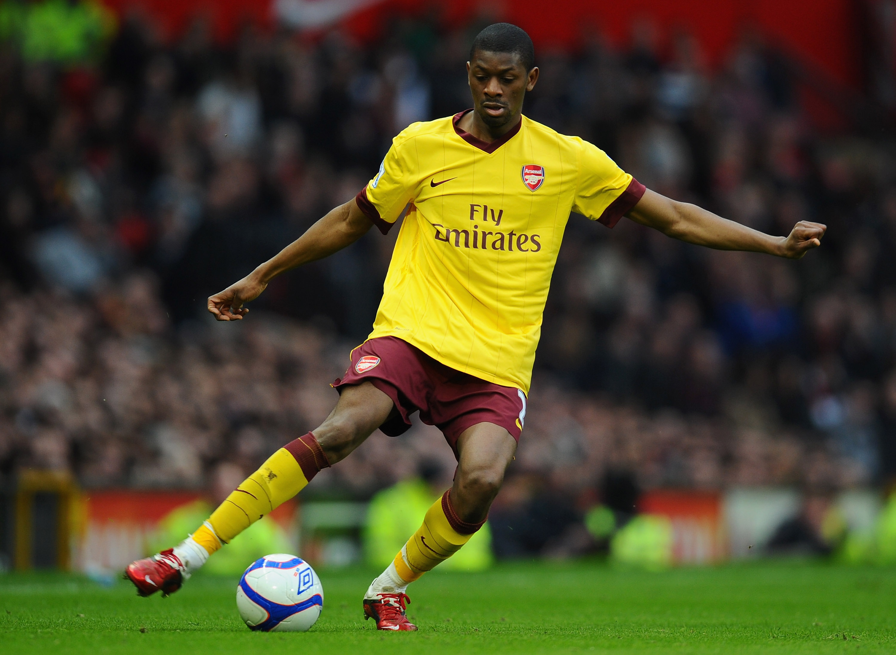 MANCHESTER, ENGLAND - MARCH 12:  Abou Diaby of Arsenal passes the ball during the FA Cup sponsored by E.On Sixth Round match between Manchester United and Arsenal at Old Trafford on March 12, 2011 in Manchester, England.  (Photo by Clive Mason/Getty Image