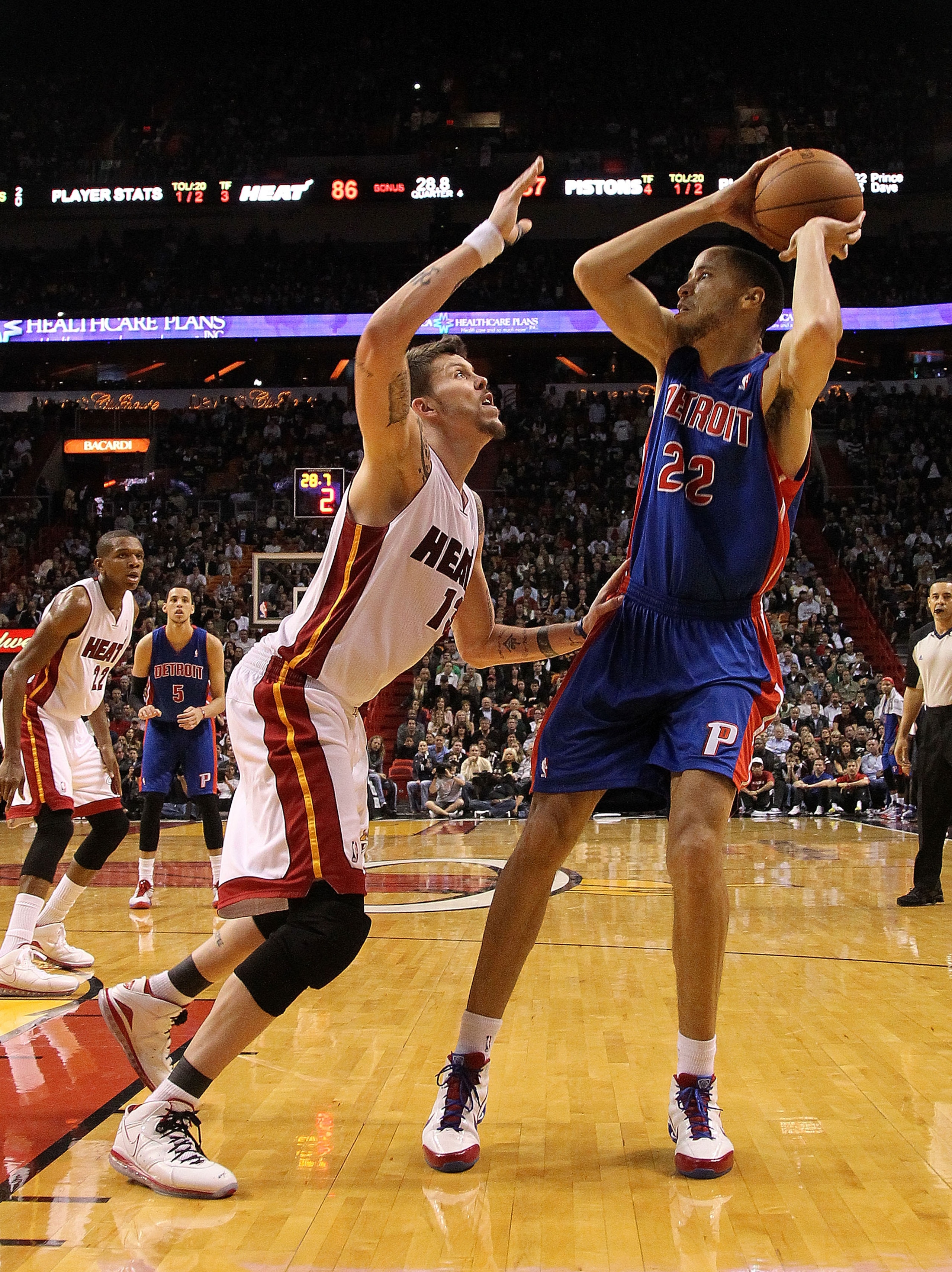 MIAMI, FL - JANUARY 28:  Tayshaun Prince #22 of of the Detroit Pistons passes over Mike Miller #13 of the Miami Heat during a game at American Airlines Arena on January 28, 2011 in Miami, Florida. NOTE TO USER: User expressly acknowledges and agrees that,
