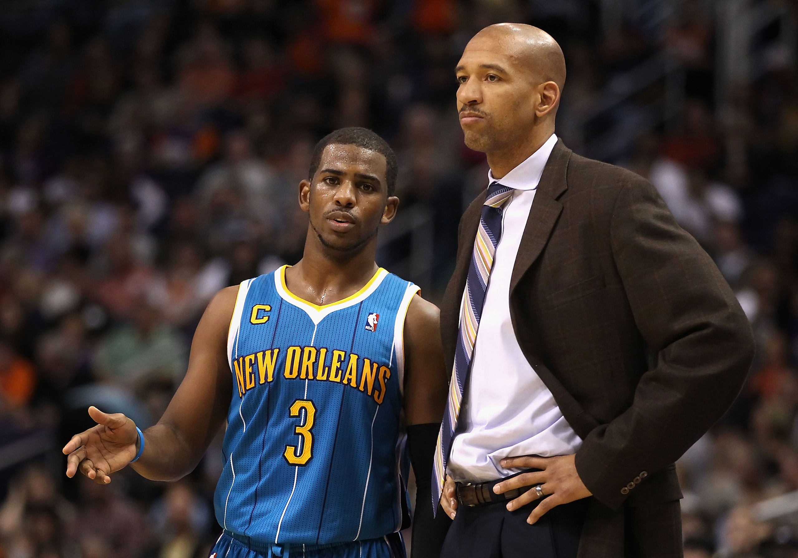 PHOENIX, AZ - JANUARY 30:  Chris Paul #3 of the New Orleans Hornets talks with head coach Monty Williams during the NBA game against the Phoenix Suns at US Airways Center on January 30, 2011 in Phoenix, Arizona. The Suns defeated the Hornets 104-102. NOTE