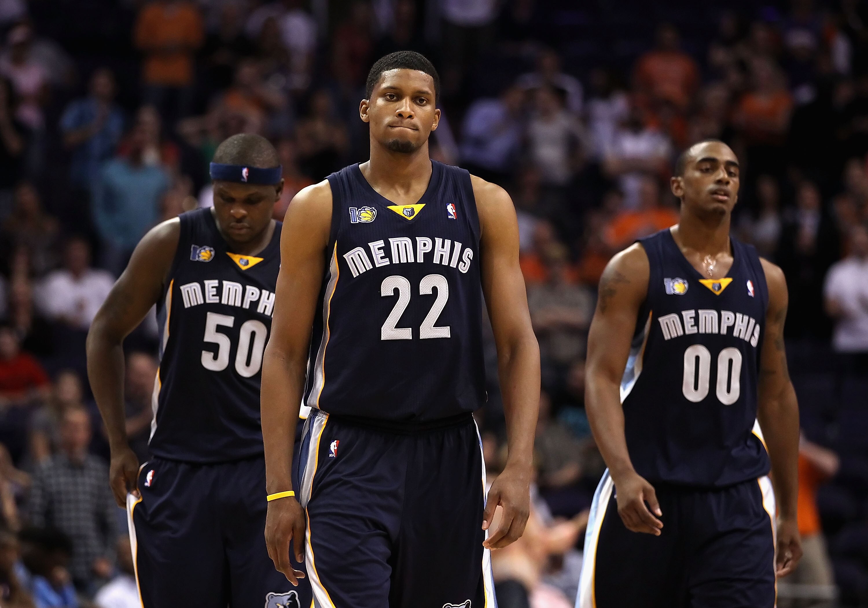 PHOENIX - NOVEMBER 05:  (L-R) Zach Randolph #50, Rudy Gay #22 and Darrell Arthur #00 of the Memphis Grizzlies react in the final moments of the NBA game against the Phoenix Suns at US Airways Center on November 5, 2010 in Phoenix, Arizona. The Suns defeat