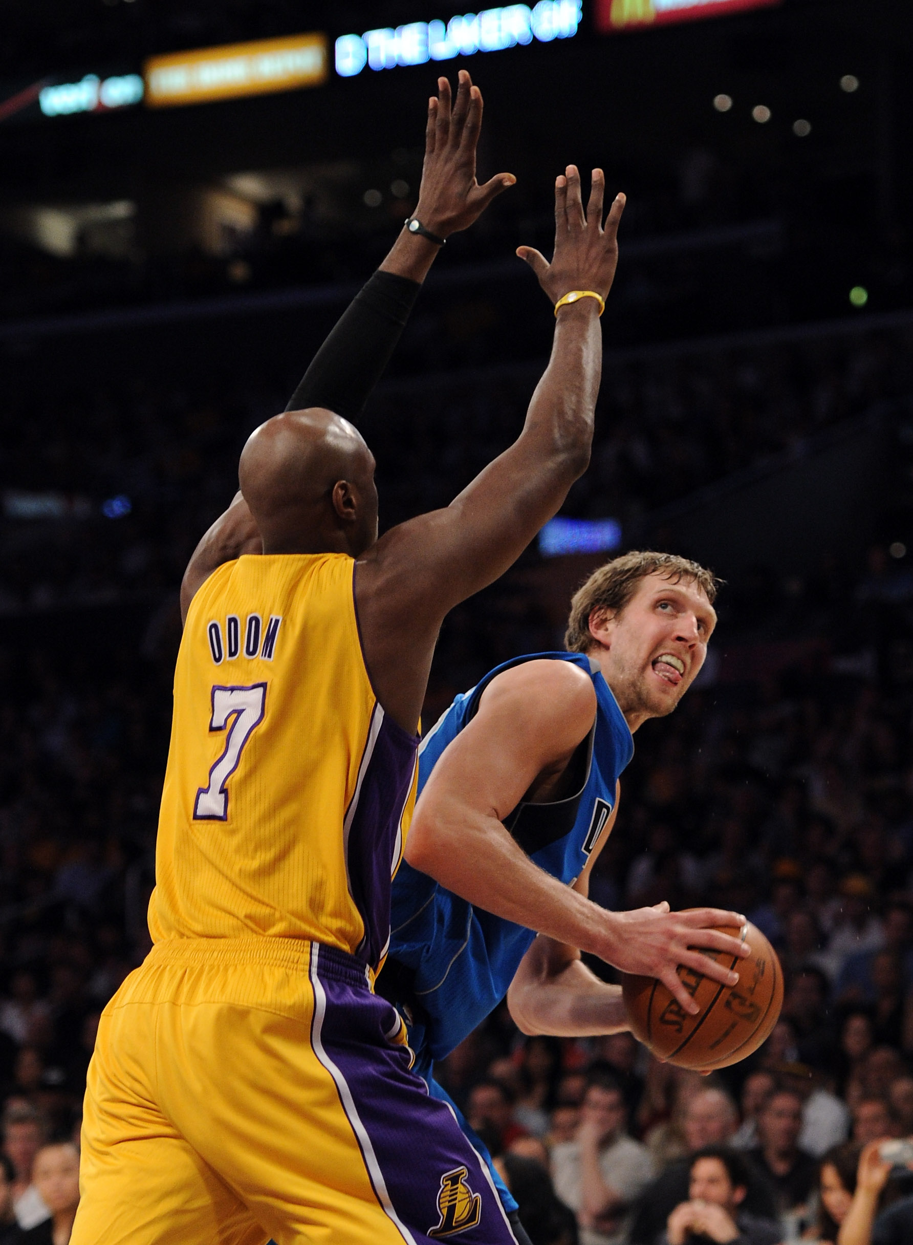 LOS ANGELES, CA - MARCH 31:  Dirk Nowitzki #41 of the Dallas Mavericks looks to shoot over the arms of Lamar Odom #7 of the Los Angeles Lakers at Staples Center on March 31, 2011 in Los Angeles, California.  NOTE TO USER: User expressly acknowledges and a