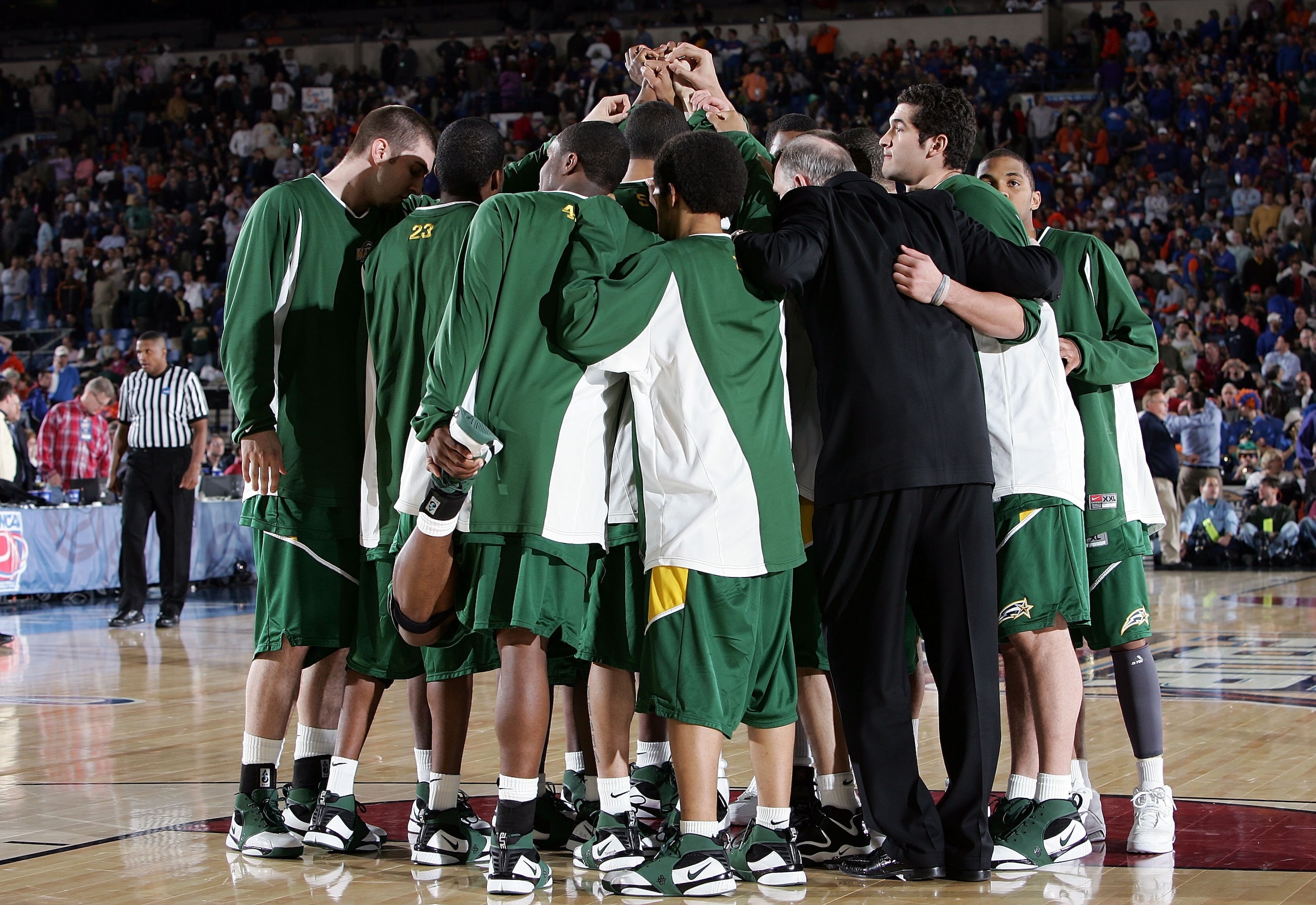 INDIANAPOLIS - APRIL 01:  The George Mason Patriots gather before the start of the second half against the Florida Gators during the semifinal game of the NCAA Men's Final Four on April 1, 2006 at the RCA Dome in Indianapolis, Indiana.  (Photo by Streeter