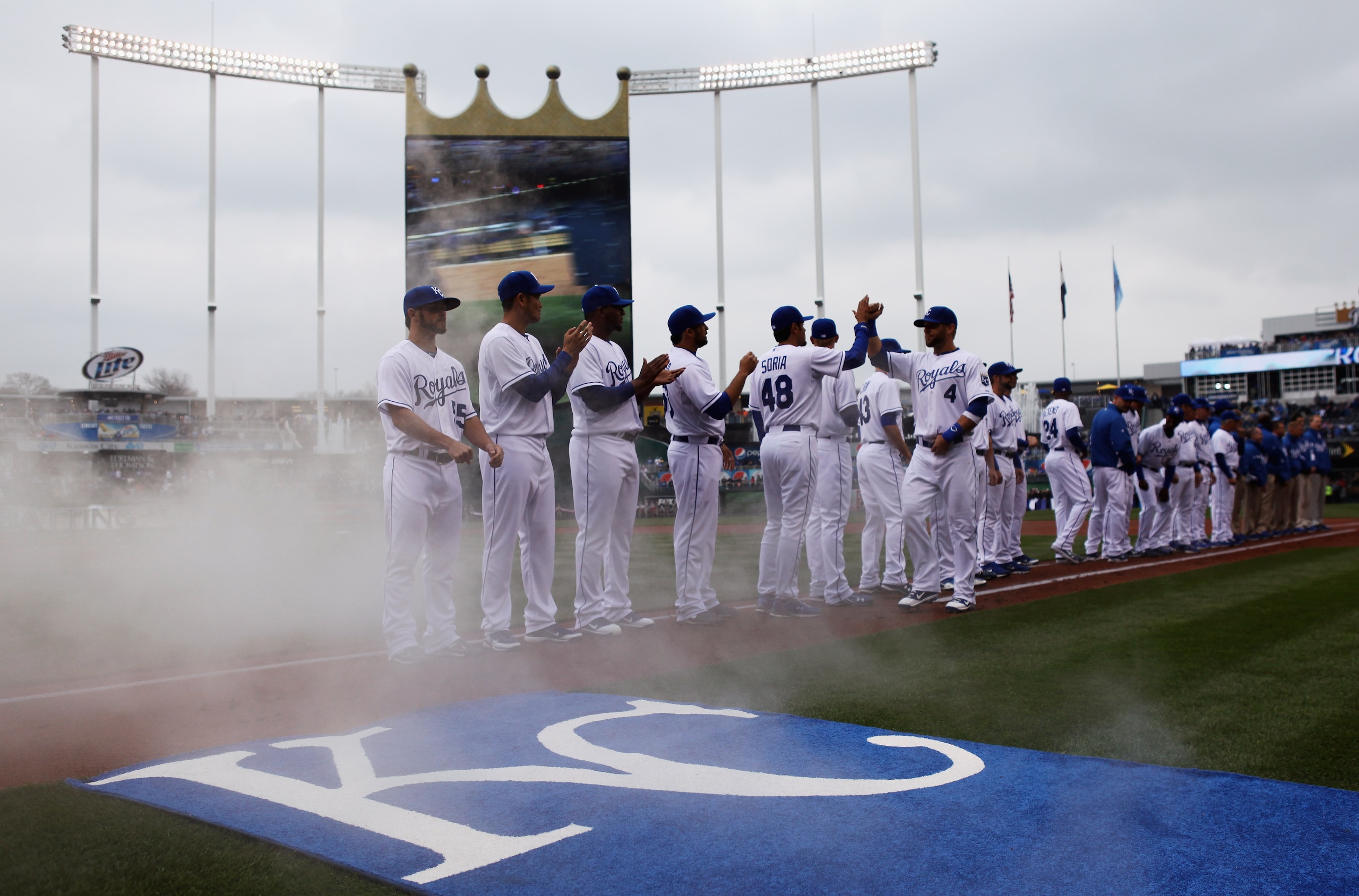 KANSAS CITY, MO - MARCH 31:  Outfielder Alex Gordon #4 of the Kansas City Royals greets teammates during player introductions prior to the start of the opening day game against the Los Angeles Angels of Anaheim at Kauffman Stadium on March 31, 2011 in Kan