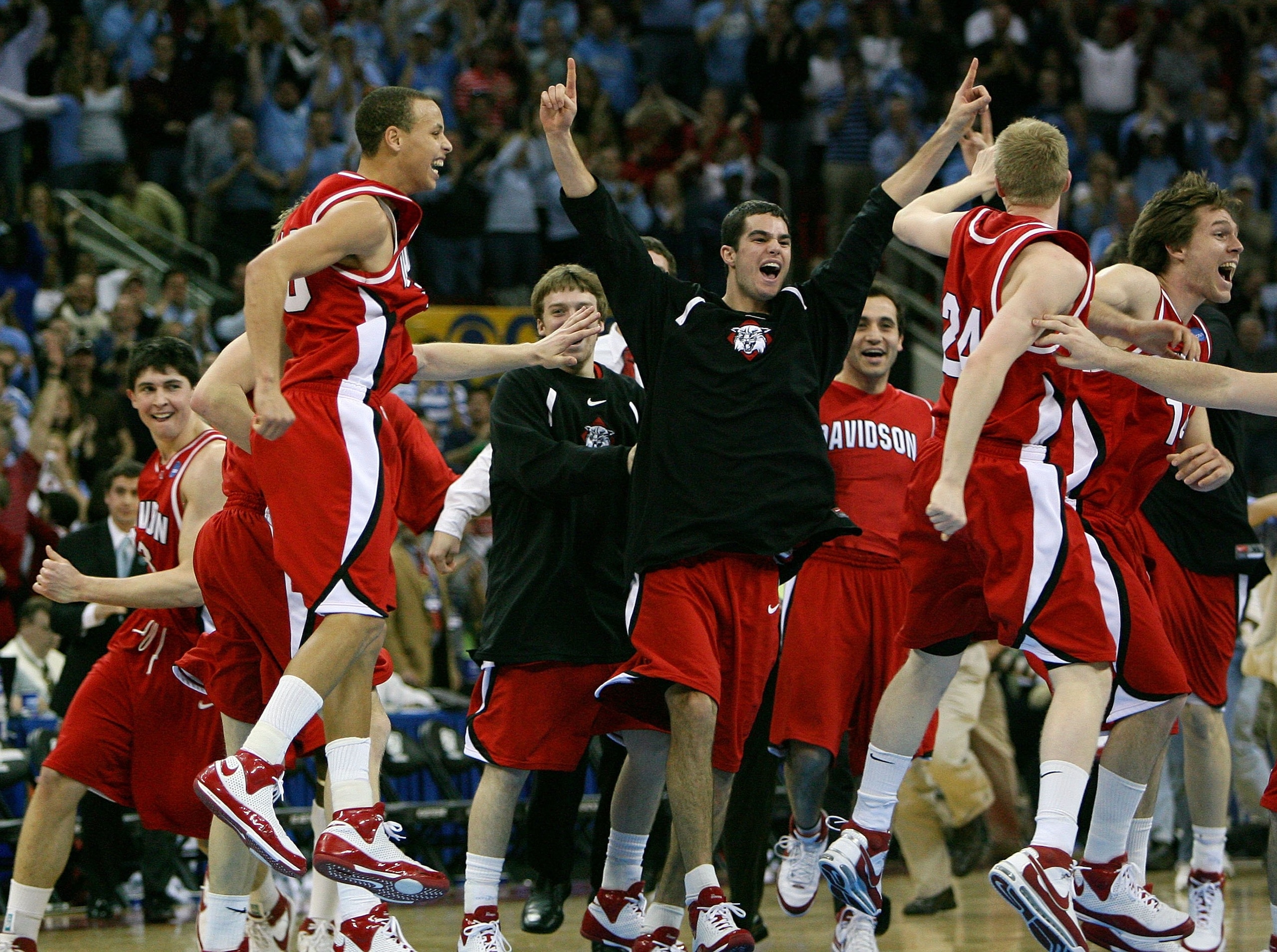 RALEIGH, NC - MARCH 23:  Stephen Curry #30 of the Davidson Wildcats and teammates celebrate after defeating the Georgetown Hoyas during the 2nd round of the East Regional of the 2008 NCAA Men's Basketball Tournament at RBC Center on March 23, 2008 in Rale