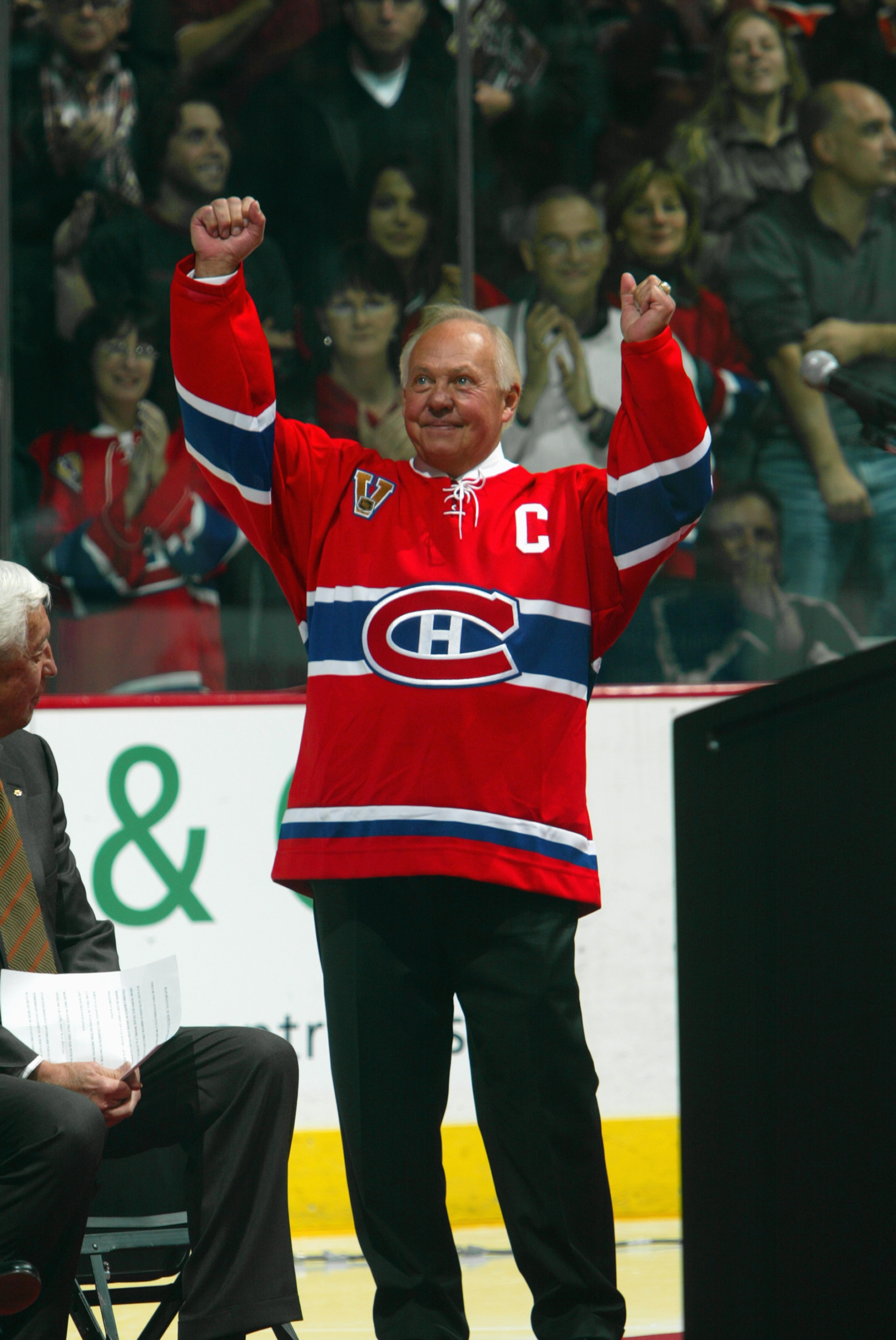 MONTREAL, CANADA - NOVEMBER 12:  Hall of Famer Yvan Cournoyer of the Montreal Canadiens acknowledges the crowd during a ceremony to retire the #12 in honor of Cournoyer and fellow Hall of Famer Dickie Moore before the NHL game against the Toronto Maple Le