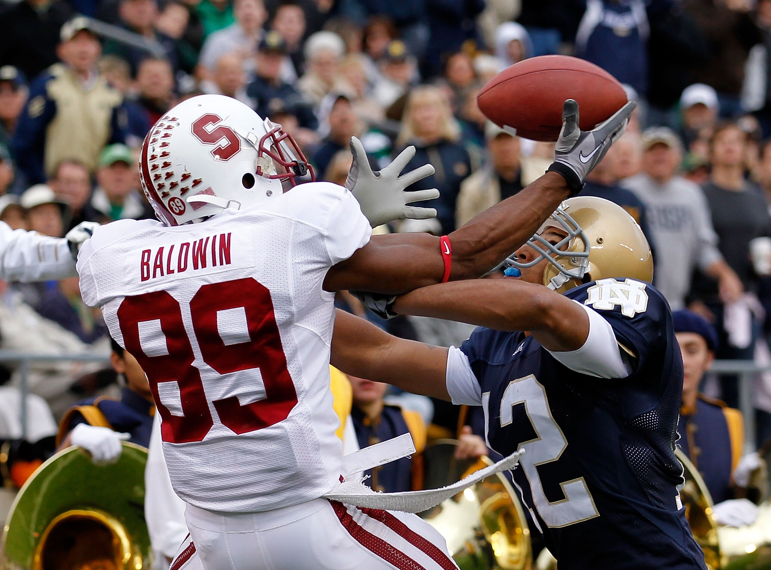 SOUTH BEND, IN - SEPTEMBER 25: Doug Baldwin #89 of the Stanford Cardinal attempts to catch the ball as Robert Blanton #12 of the Notre Dame Fighting Irish  defends at Notre Dame Stadium on September 25, 2010 in South Bend, Indiana. (Photo by Jonathan Dani