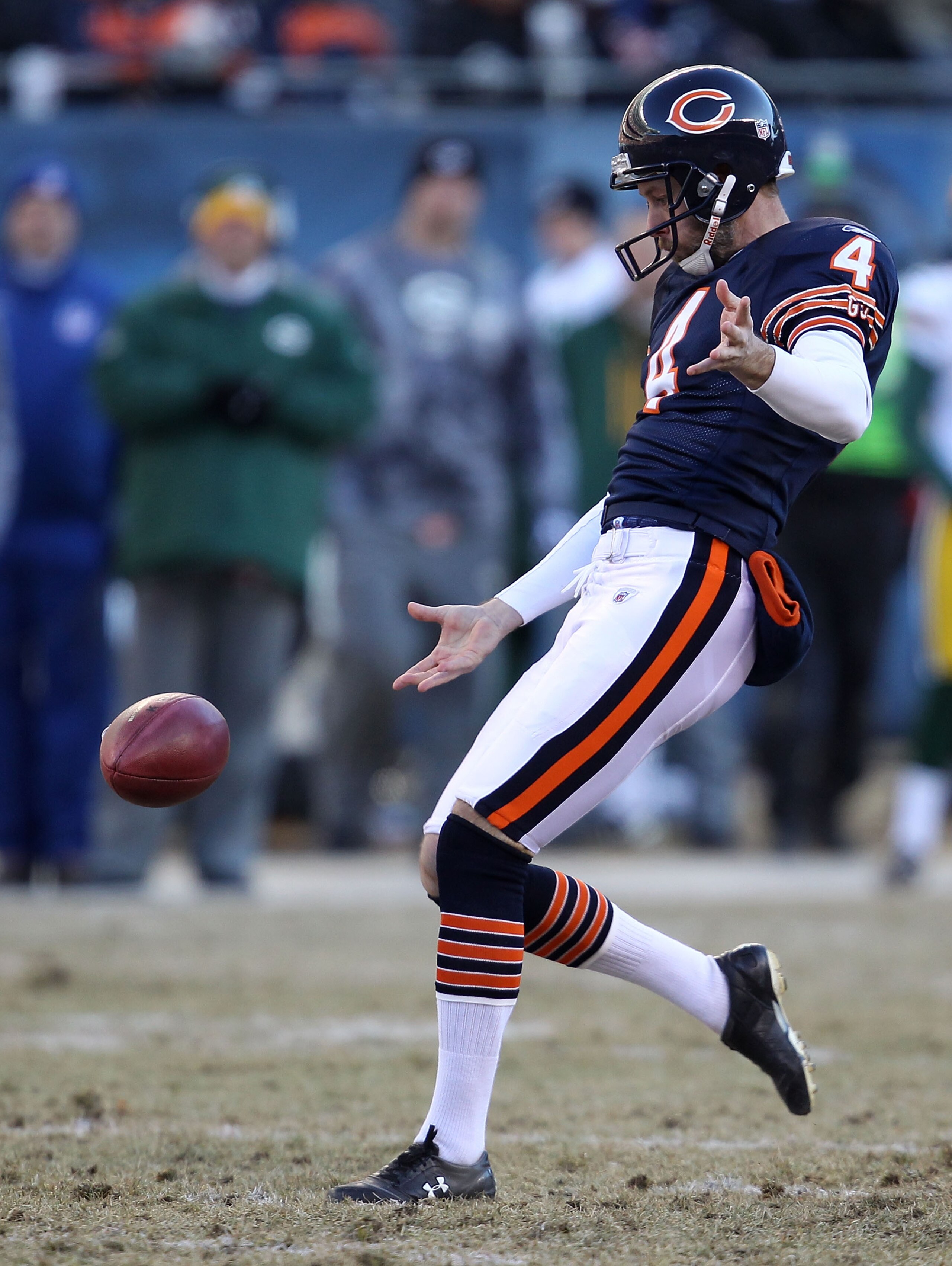 CHICAGO, IL - JANUARY 23:  Brad Maynard #4 of the Chicago Bears punts against the Green Bay Packers in the NFC Championship Game at Soldier Field on January 23, 2011 in Chicago, Illinois.  (Photo by Jonathan Daniel/Getty Images)
