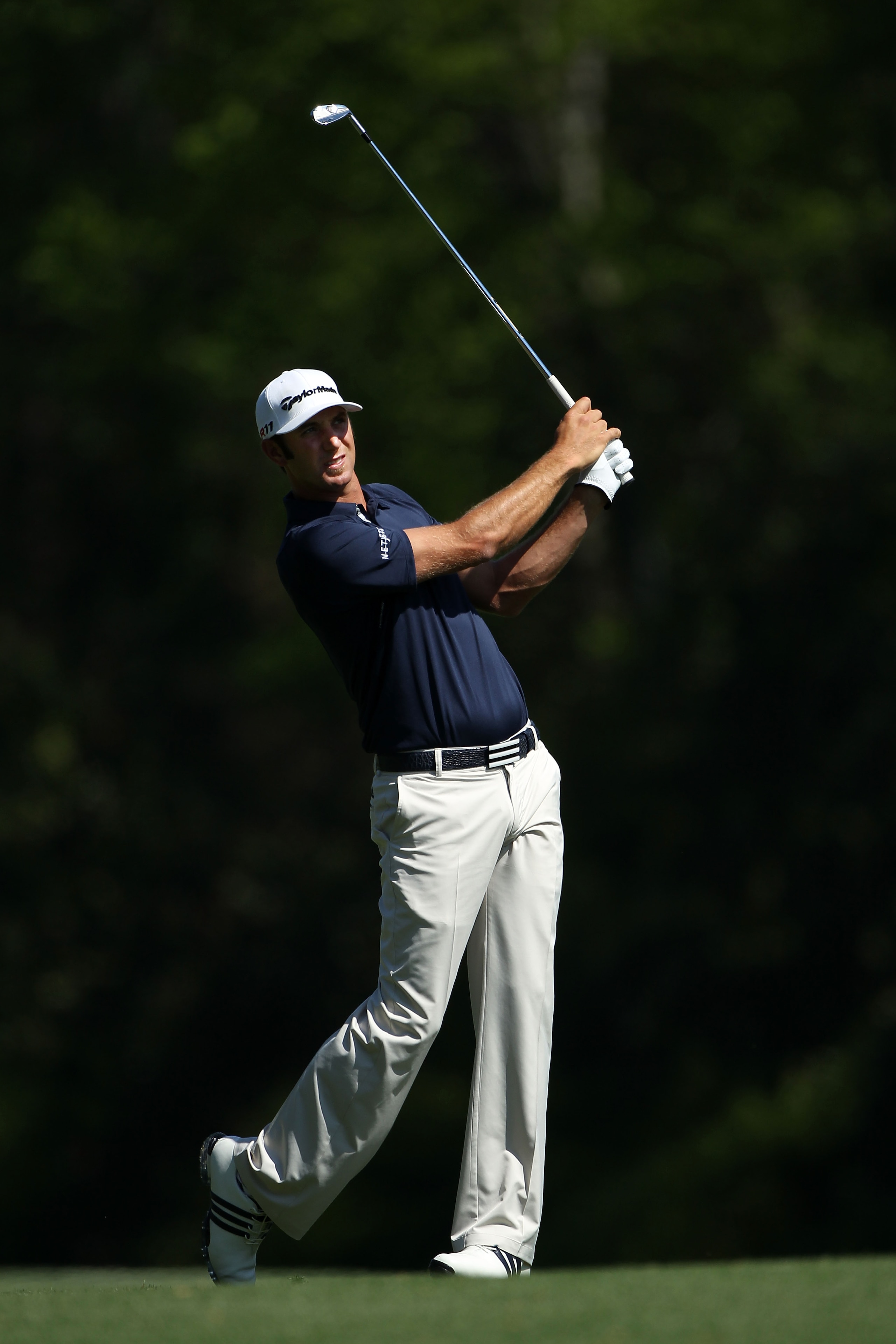 AUGUSTA, GA - APRIL 04:  Dustin Johnson watches a shot during a practice round prior to the 2011 Masters Tournament at Augusta National Golf Club on April 4, 2011 in Augusta, Georgia.  (Photo by Andrew Redington/Getty Images)