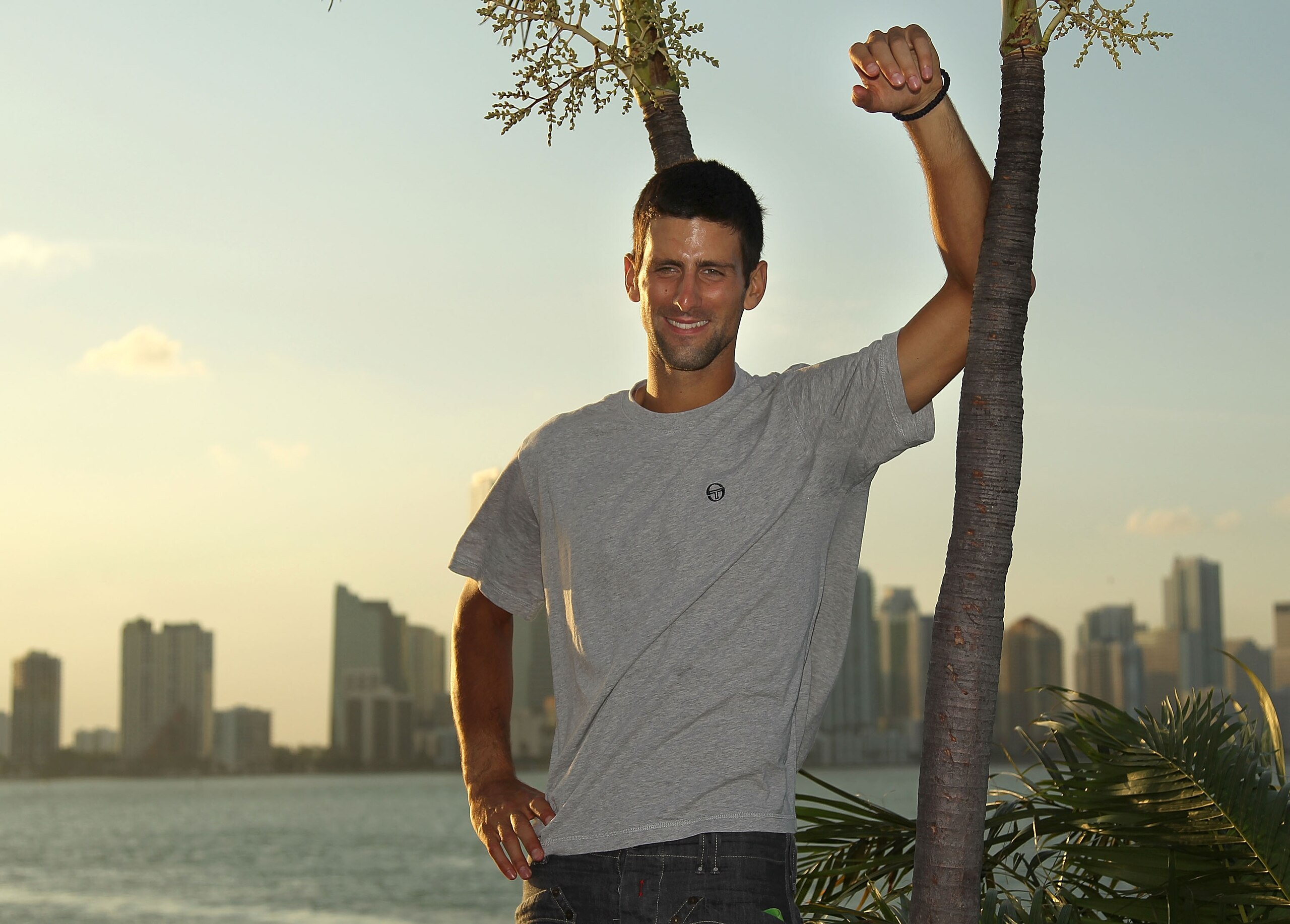 KEY BISCAYNE, FL - APRIL 03:  Novak Djokovic of Serbia poses with the trophy at the Rusty Pelican Restraunt after winning the men's singles title from the Sony Ericsson Open at Crandon Park Tennis Center on April 3, 2011 in Key Biscayne, Florida.  (Photo