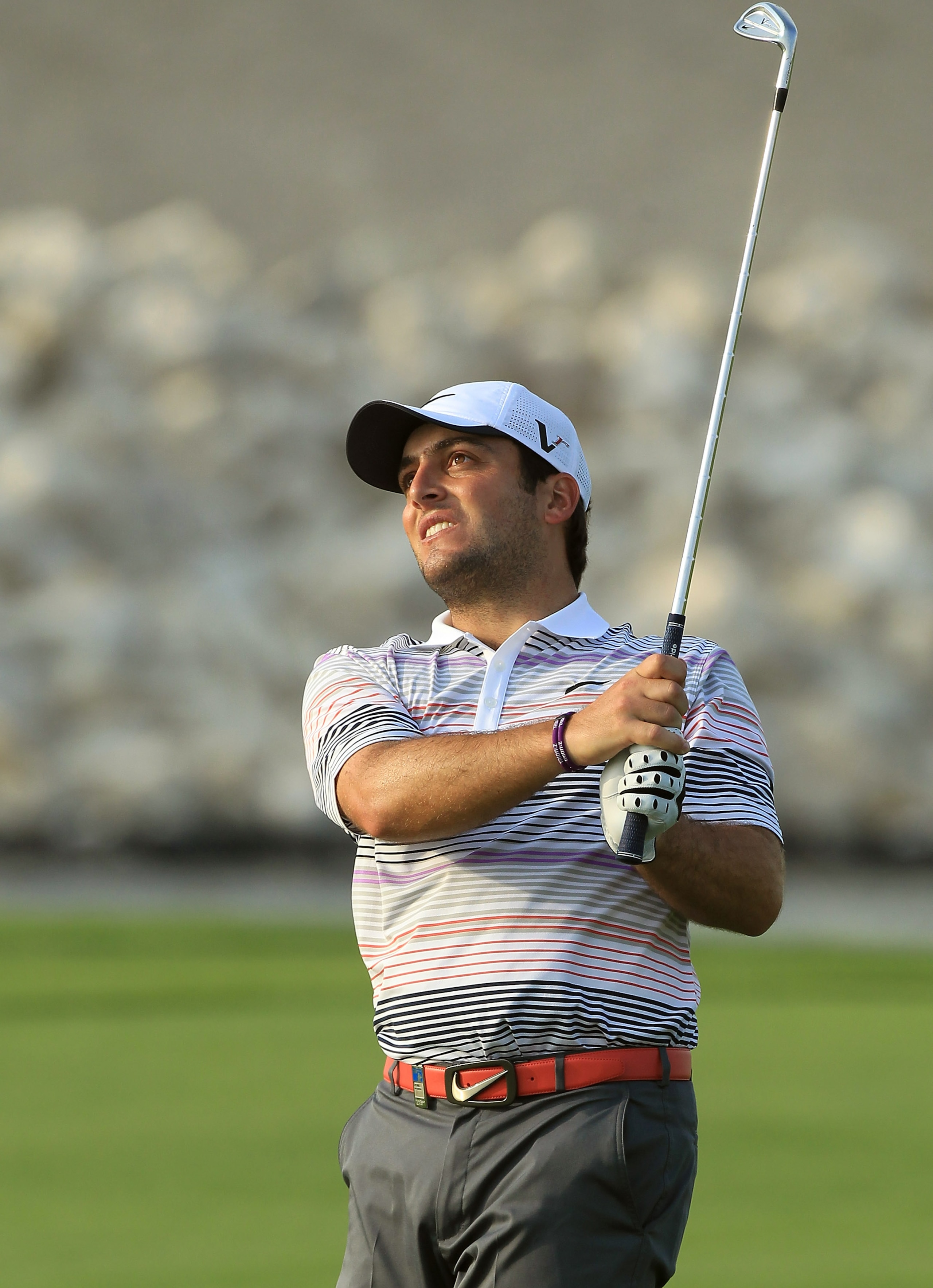 BAHRAIN, BAHRAIN - JANUARY 30:  Francesco Molinari of Italy plays his second shot at the 18th hole during the final round of the 2011 Volvo Champions held at the Royal Golf Club on January 30, 2011 in Bahrain, Bahrain.  (Photo by David Cannon/Getty Images
