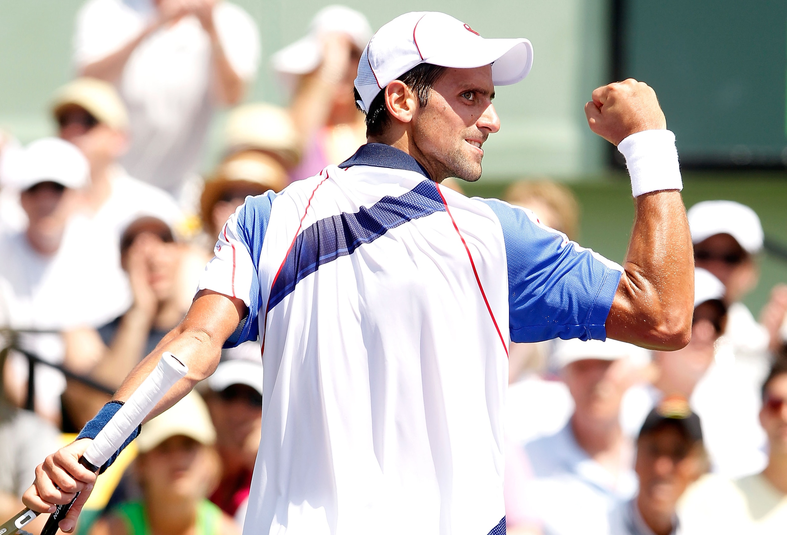 KEY BISCAYNE, FL - APRIL 03:  Novak Djokovic of Serbia reacts against Rafael Nadal of Spain during the men's singles championship at the Sony Ericsson Open at Crandon Park Tennis Center on April 3, 2011 in Key Biscayne, Florida.  (Photo by Matthew Stockma