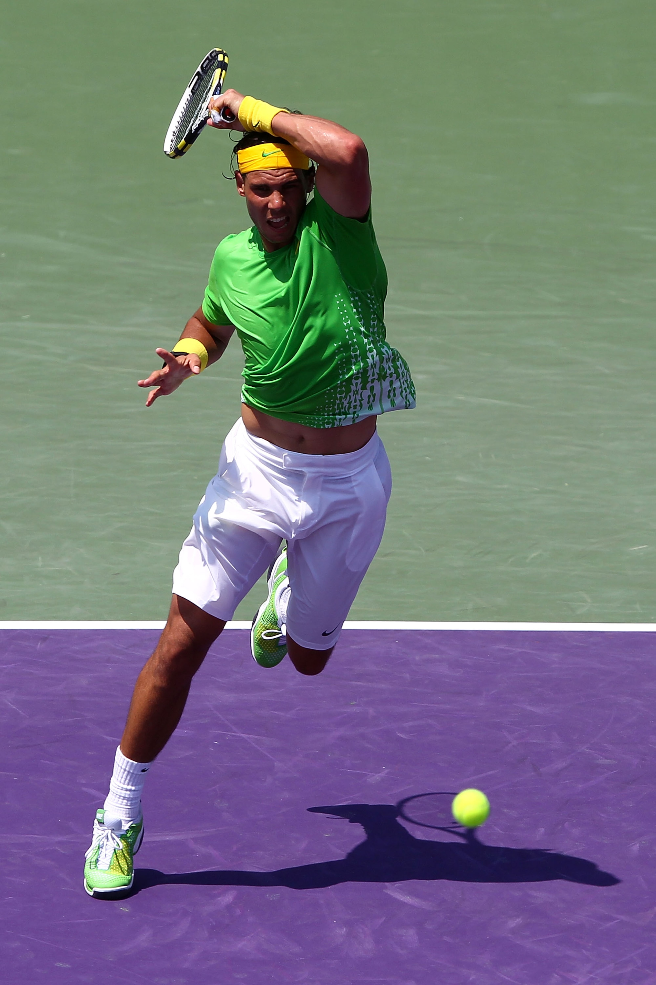 KEY BISCAYNE, FL - APRIL 03:  Rafael Nadal of Spain hits a forehand return against Novak Djokovic of Serbia during the men's singles championship at the Sony Ericsson Open at Crandon Park Tennis Center on April 3, 2011 in Key Biscayne, Florida.  (Photo by
