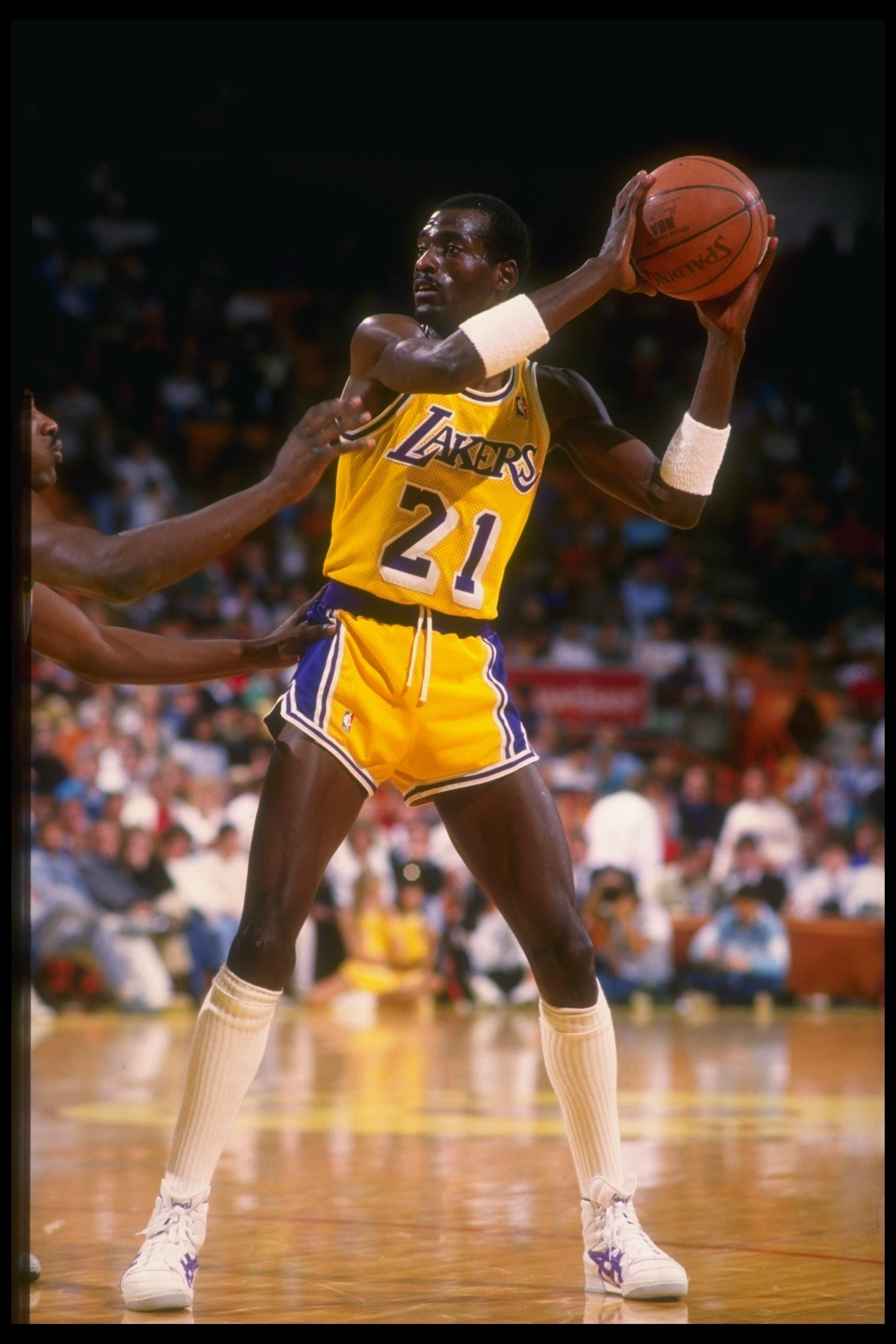Dec 1987: Michael Cooper of the Los Angeles Lakers looks to pass the ball during a game. Mandatory Credit: Mike Powell /Allsport Mandatory Credit: Mike Powell /Allsport Dec 1987: Michael Cooper of the Los Angeles Lakers looks to pass the ball during a game. Mandatory Credit: Mike Powell /Allsport Mandatory Credit: Mike Powell /Allsport