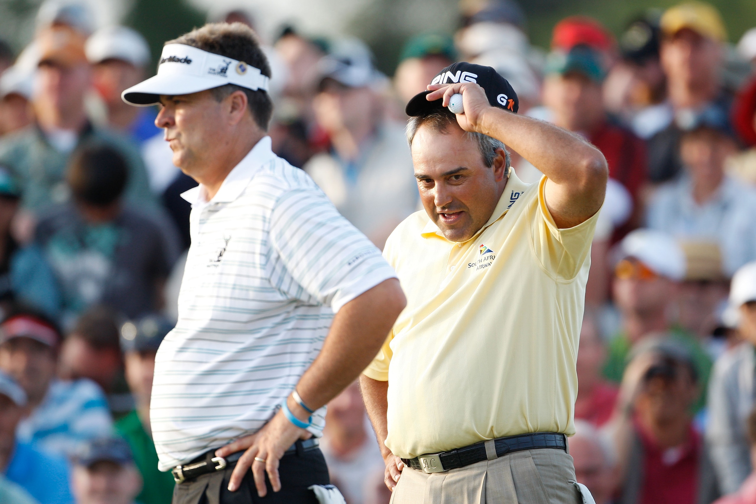 AUGUSTA, GA - APRIL 12:  Kenny Perry and Angel Cabrera of Argentina wait on the first sudden death playoff hole during the final round of the 2009 Masters Tournament at Augusta National Golf Club on April 12, 2009 in Augusta, Georgia.  (Photo by Jamie Squ