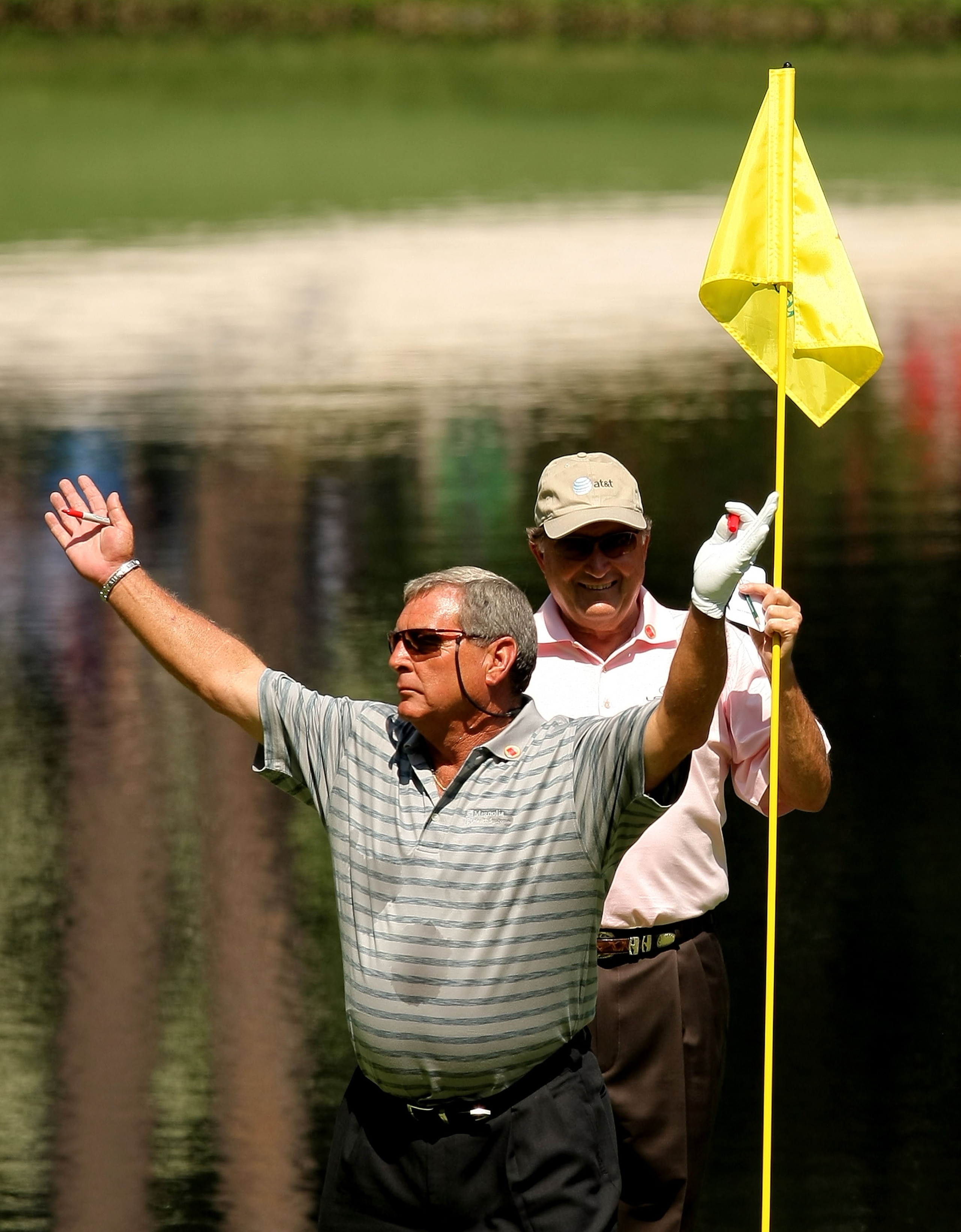 AUGUSTA, GA - APRIL 09:  Fuzzy Zoeller waves to the crowd in front of Raymund Floyd during the Par 3 Contest prior to the start of the 2008 Masters Tournament at Augusta National Golf Club on April 9, 2008 in Augusta, Georgia.  (Photo by Harry How/Getty I