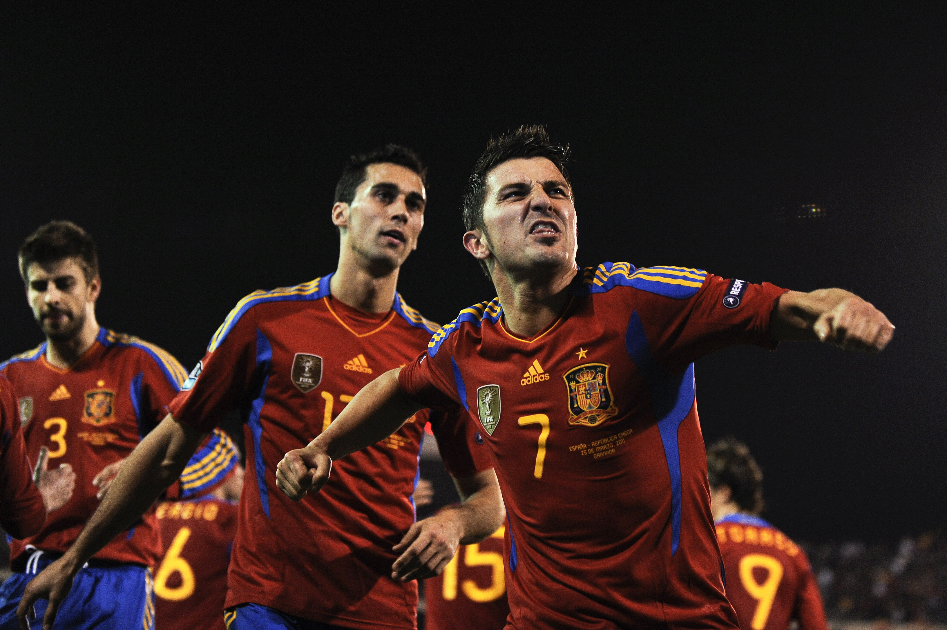 GRANADA, SPAIN - MARCH 25:  David Villa (R) of Spain celebrates after scoring his second goal during the UEFA EURO 2012 qualifier between Spain and Czech Republic at Los Carmenes Stadium on March 25, 2011 in Granada, Spain.  Spain win 2-1. (Photo by David