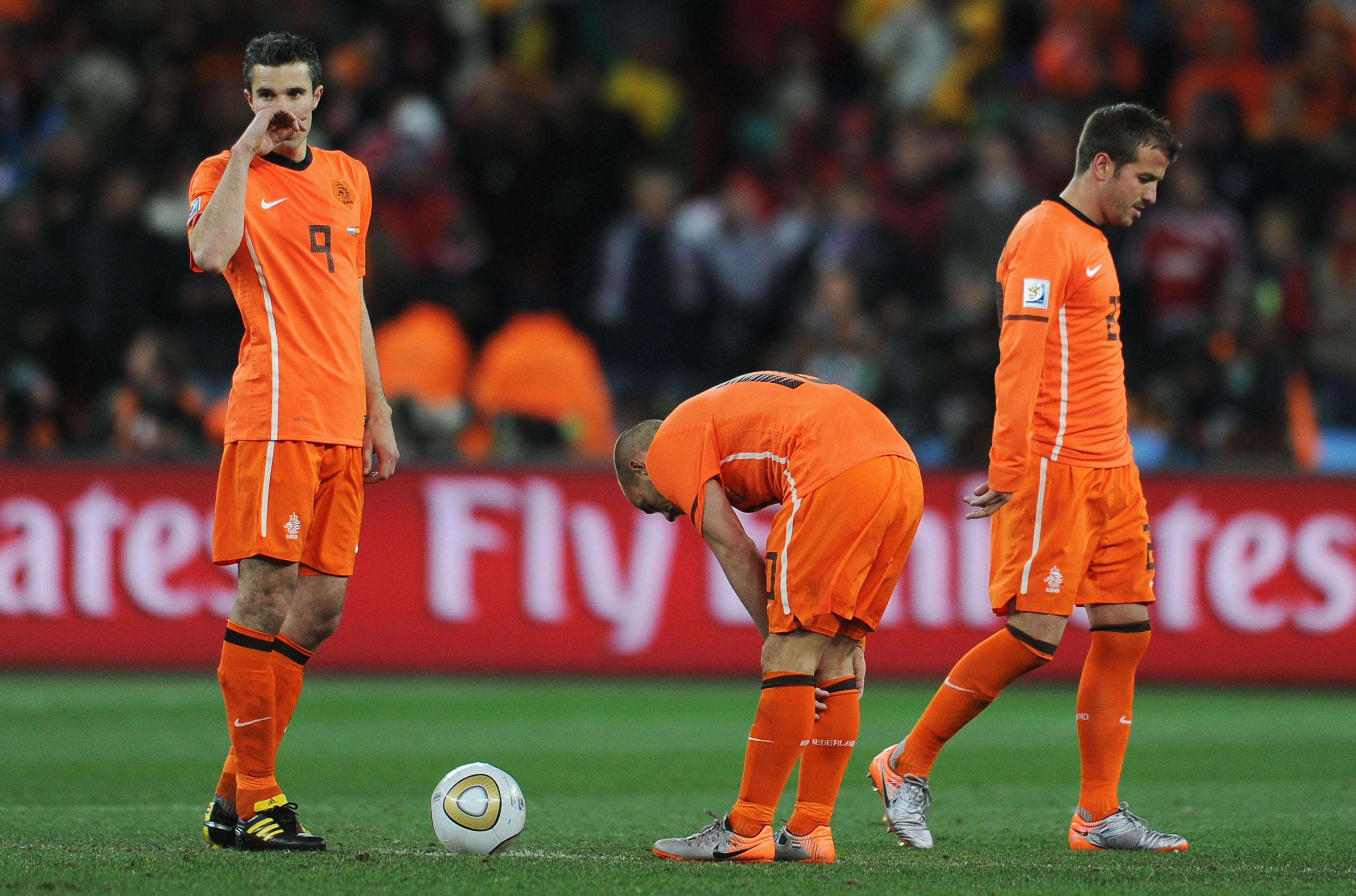 JOHANNESBURG, SOUTH AFRICA - JULY 11: Robin Van Persie, Wesley Sneijder and Rafael Van der Vaart of the Netherlands prepare to restart the match following a late Spain goal during the 2010 FIFA World Cup South Africa Final match between Netherlands and Sp