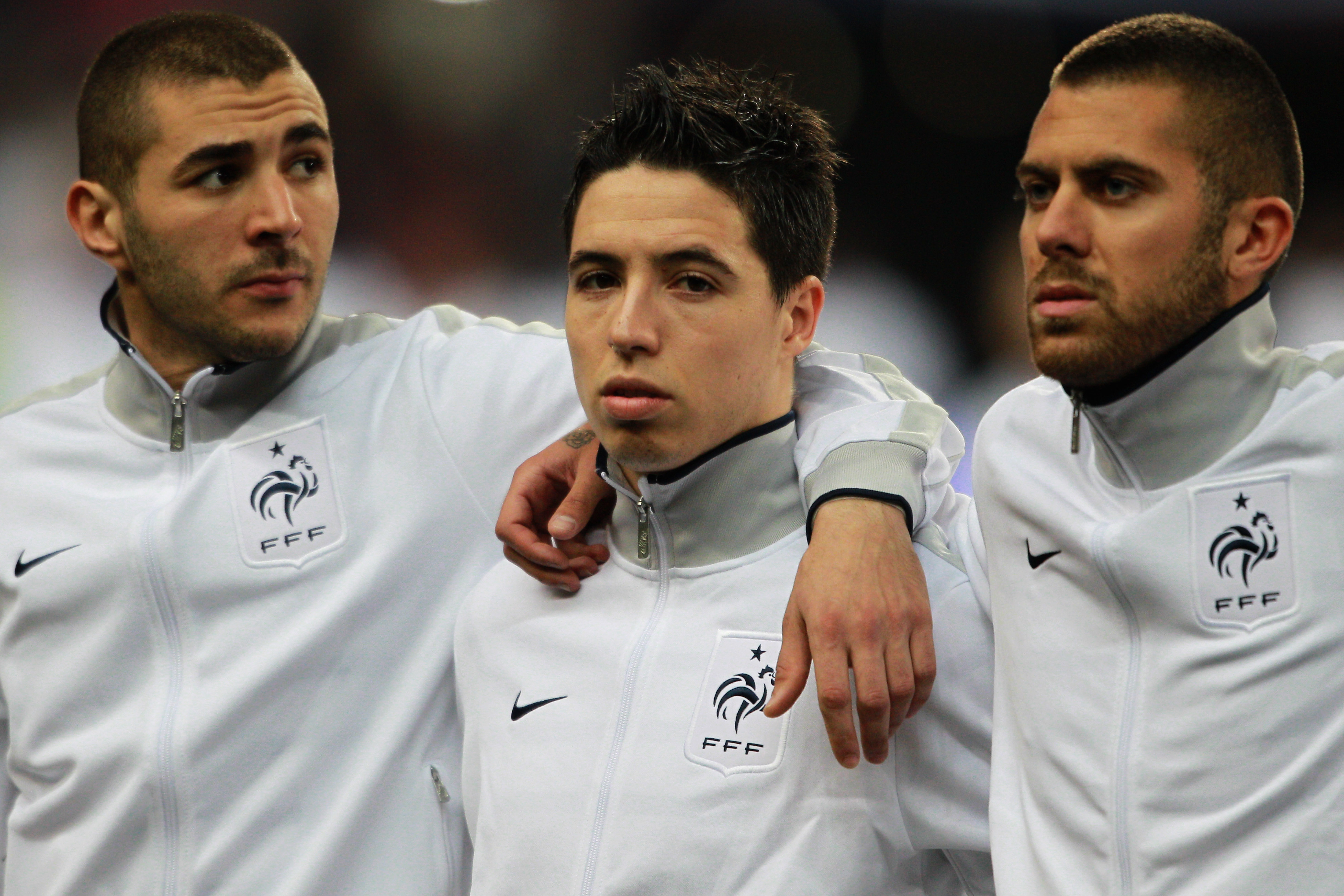 PARIS, FRANCE - MARCH 29:  (L-R)  Karim Benzema, Samir Nasri and Jeremy Menez of France stand for the national anthem during the International friendly match between France and Croatia at Stade de France on March 29, 2011 in Paris, France.  (Photo by Dean