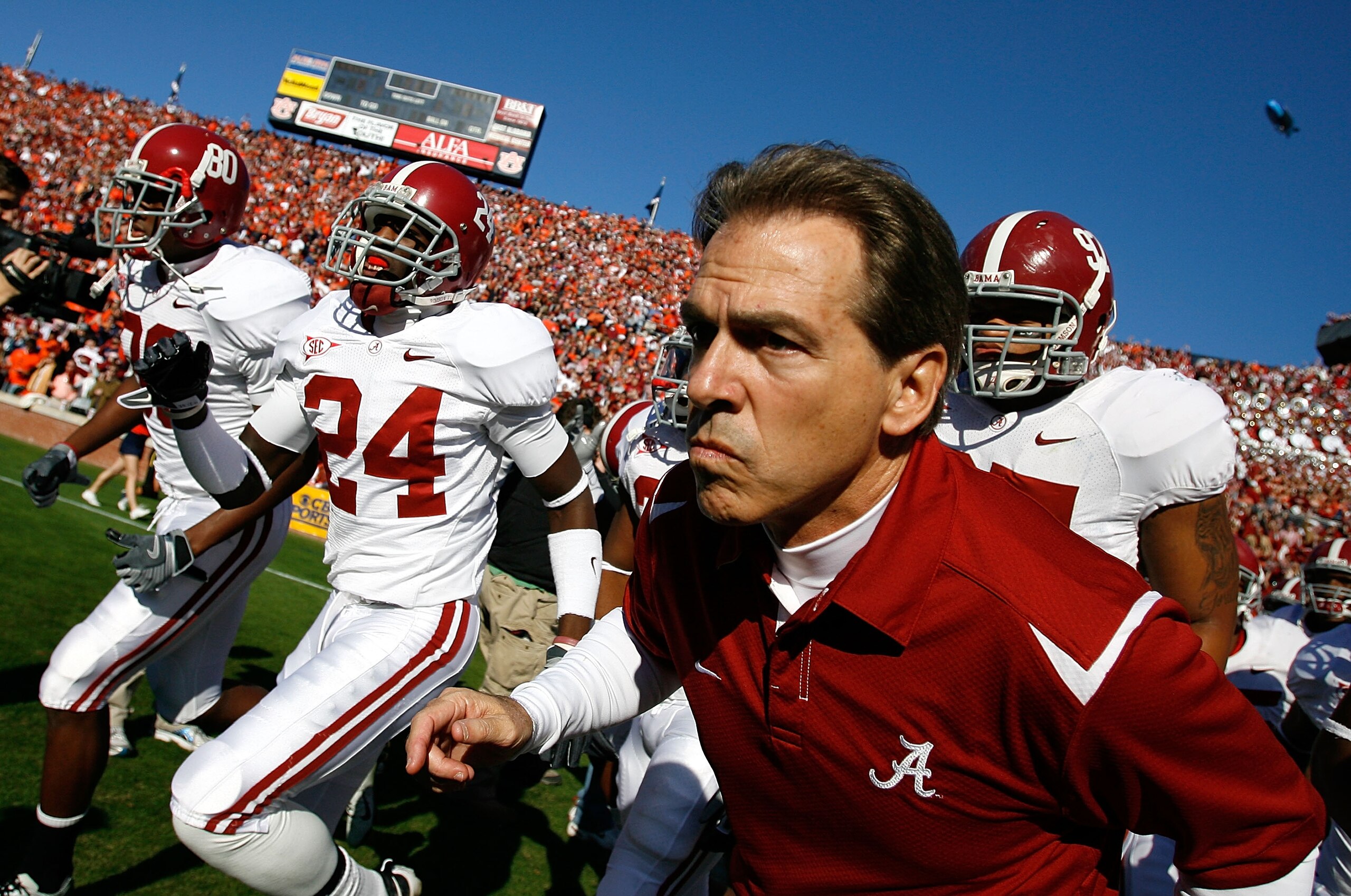 AUBURN, AL - NOVEMBER 27: Head coach Nick Saban of the Alabama Crimson Tide leads his team onto the field to face the Auburn Tigers at Jordan-Hare Stadium on November 27, 2009 in Auburn, Alabama. (Photo by Kevin C. Cox/Getty Images) AUBURN, AL - NOVEMBER 27: Head coach Nick Saban of the Alabama Crimson Tide leads his team onto the field to face the Auburn Tigers at Jordan-Hare Stadium on November 27, 2009 in Auburn, Alabama. (Photo by Kevin C. Cox/Getty Images)