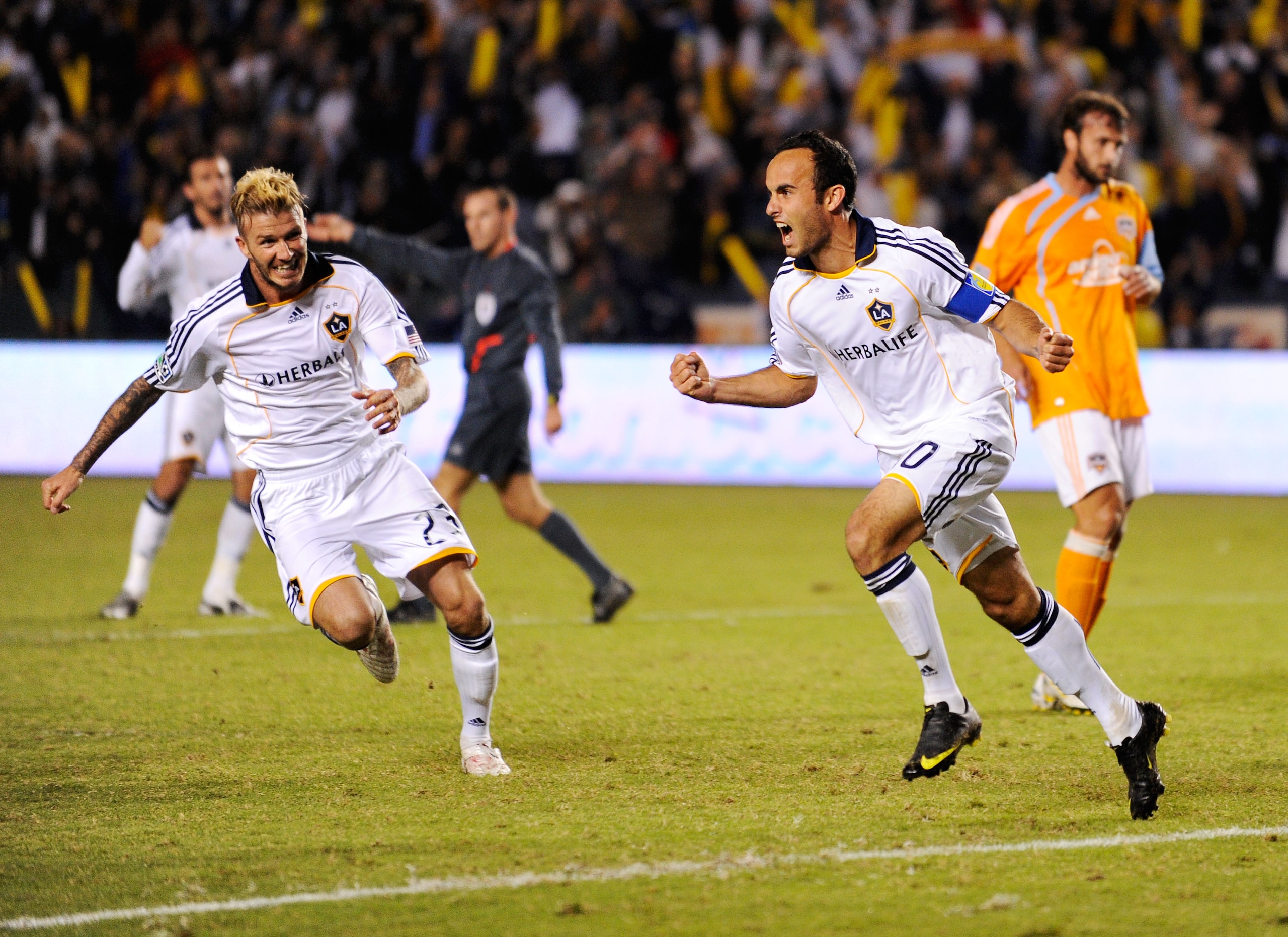 CARSON, CA - NOVEMBER 13:  David Beckham #23  and Landon Donovan #10 of the Los Angeles Galaxy celebrate after Donovan's goal on a penalty kick against  Houston Dynamo during the MLS Western Conference Championship soccer match at The Home Depot Center on