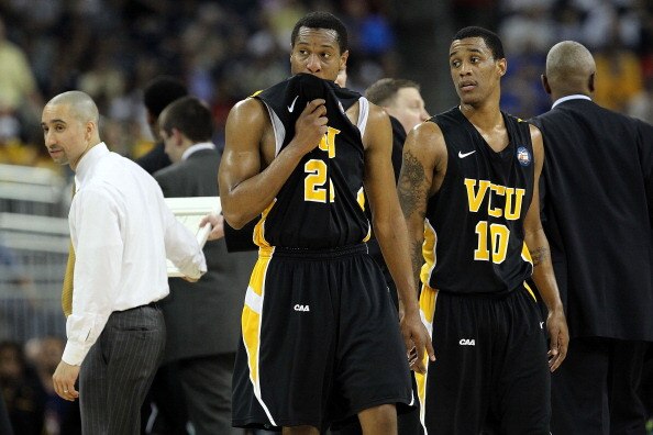 HOUSTON, TX - APRIL 02:  Bradford Burgess #20 and Darius Theus #10 of the Virginia Commonwealth Rams look on against the Butler Bulldogs during the National Semifinal game of the 2011 NCAA Division I Men's Basketball Championship at Reliant Stadium on Apr