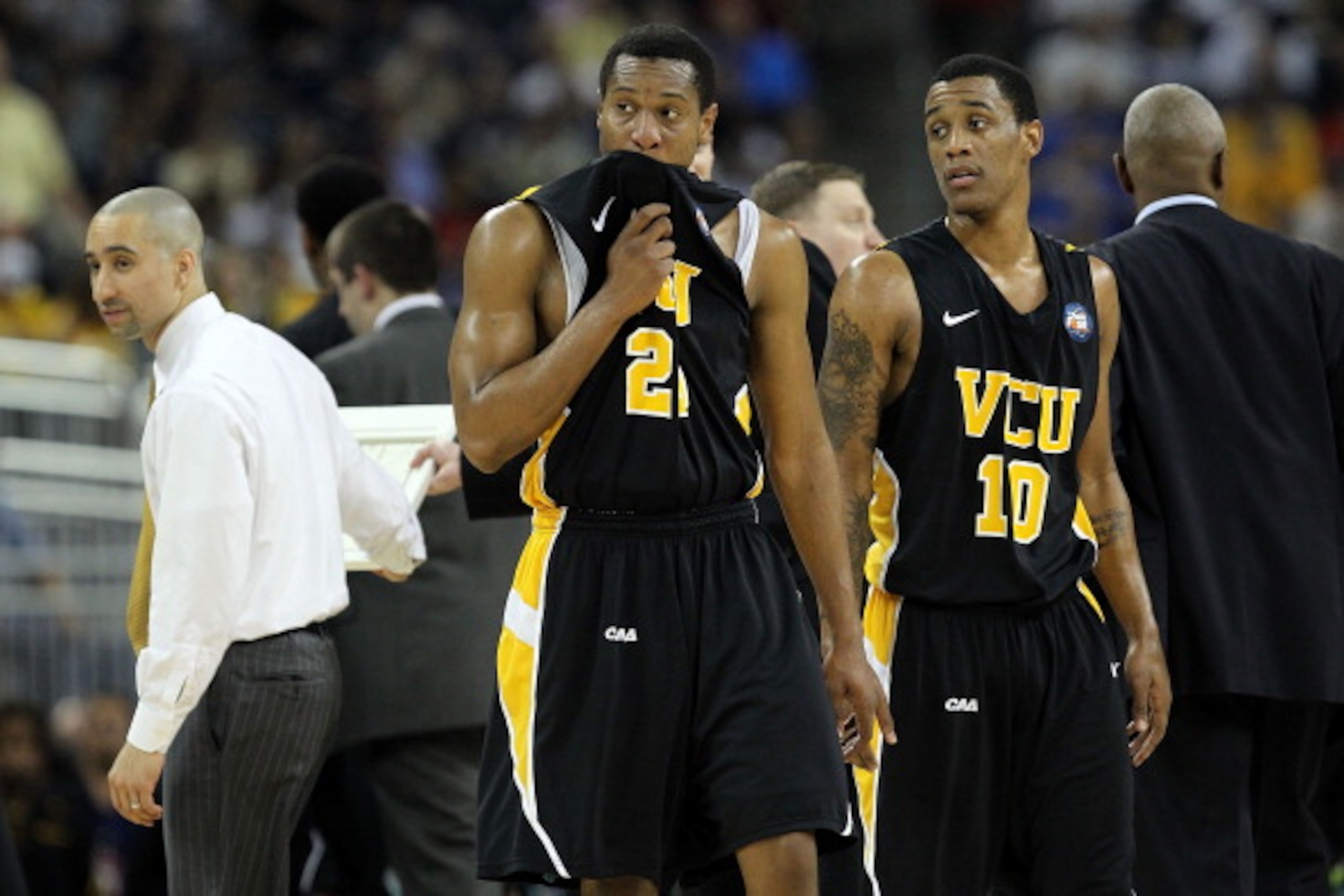 HOUSTON, TX - APRIL 02:  Bradford Burgess #20 and Darius Theus #10 of the Virginia Commonwealth Rams look on against the Butler Bulldogs during the National Semifinal game of the 2011 NCAA Division I Men's Basketball Championship at Reliant Stadium on Apr