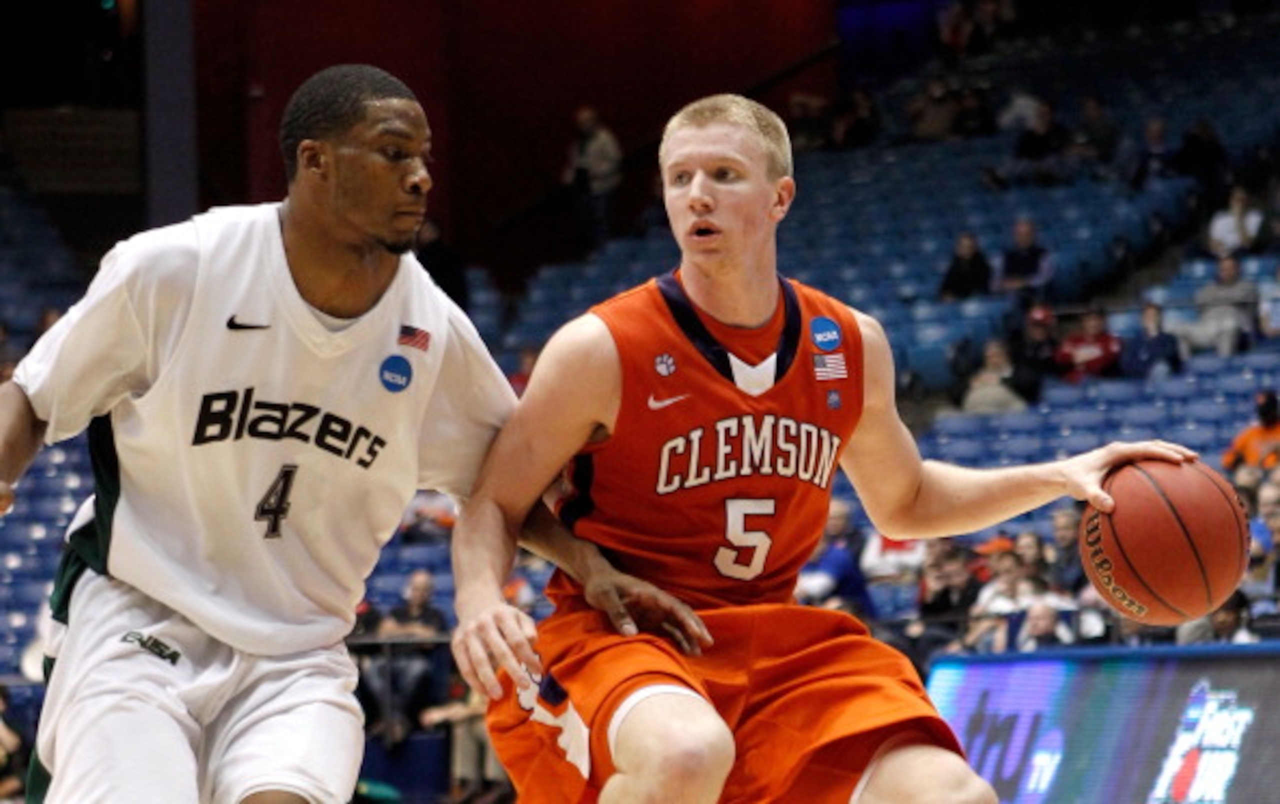 DAYTON, OH - MARCH 15: Tanner Smith #5 of the Clemson Tigers handles the ball against Jamarr Sanders #4 of the UAB Blazers during the first round of the 2011 NCAA men's basketball tournament at UD Arena on March 15, 2011 in Dayton, Ohio.  (Photo by Gregor