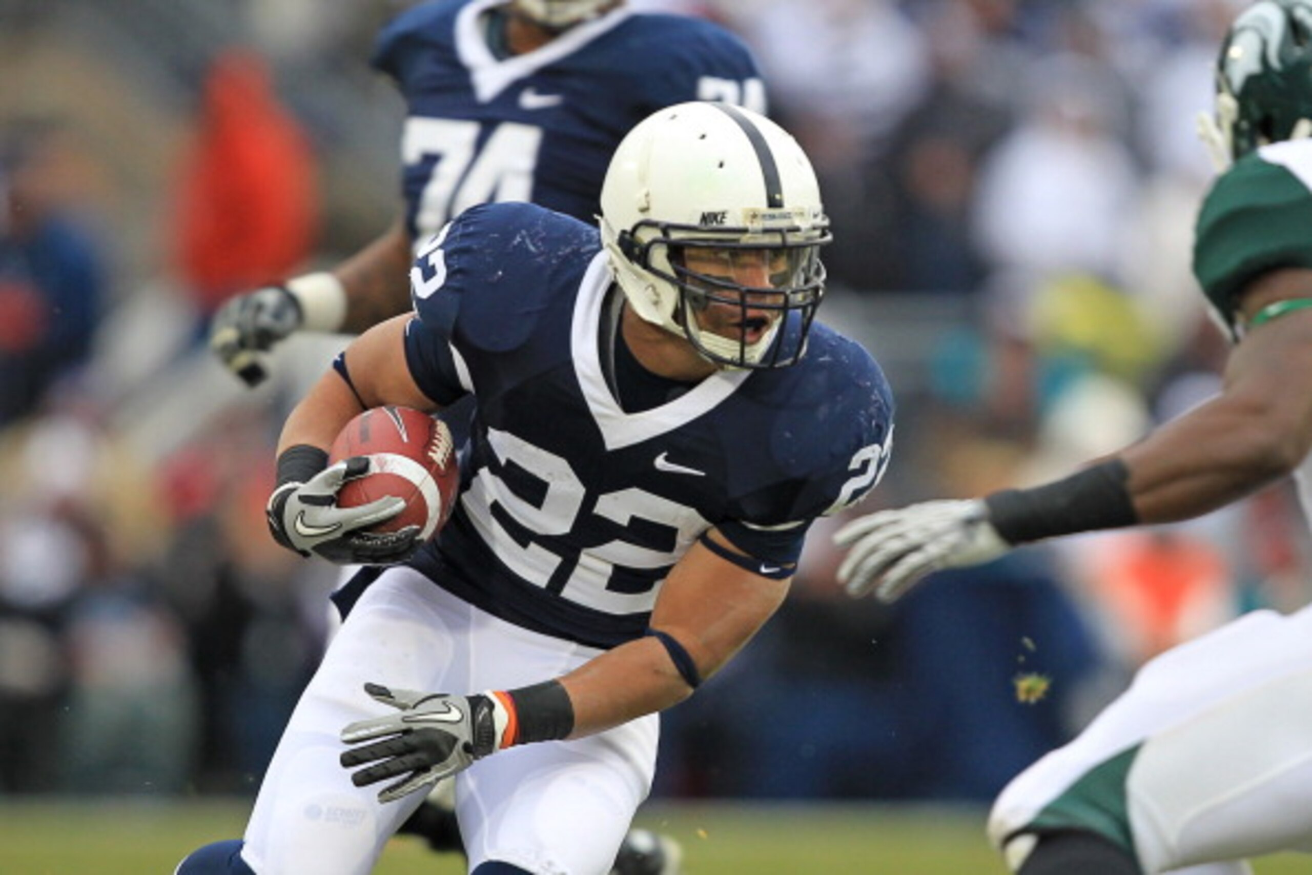 STATE COLLEGE, PA - NOVEMBER 27: Running back Evan Royster #22 of the Penn State Nittany Lions carries the ball during a game against the Michigan State Spartans on November 27, 2010 at Beaver Stadium in State College, Pennsylvania. The Spartans won 28-22