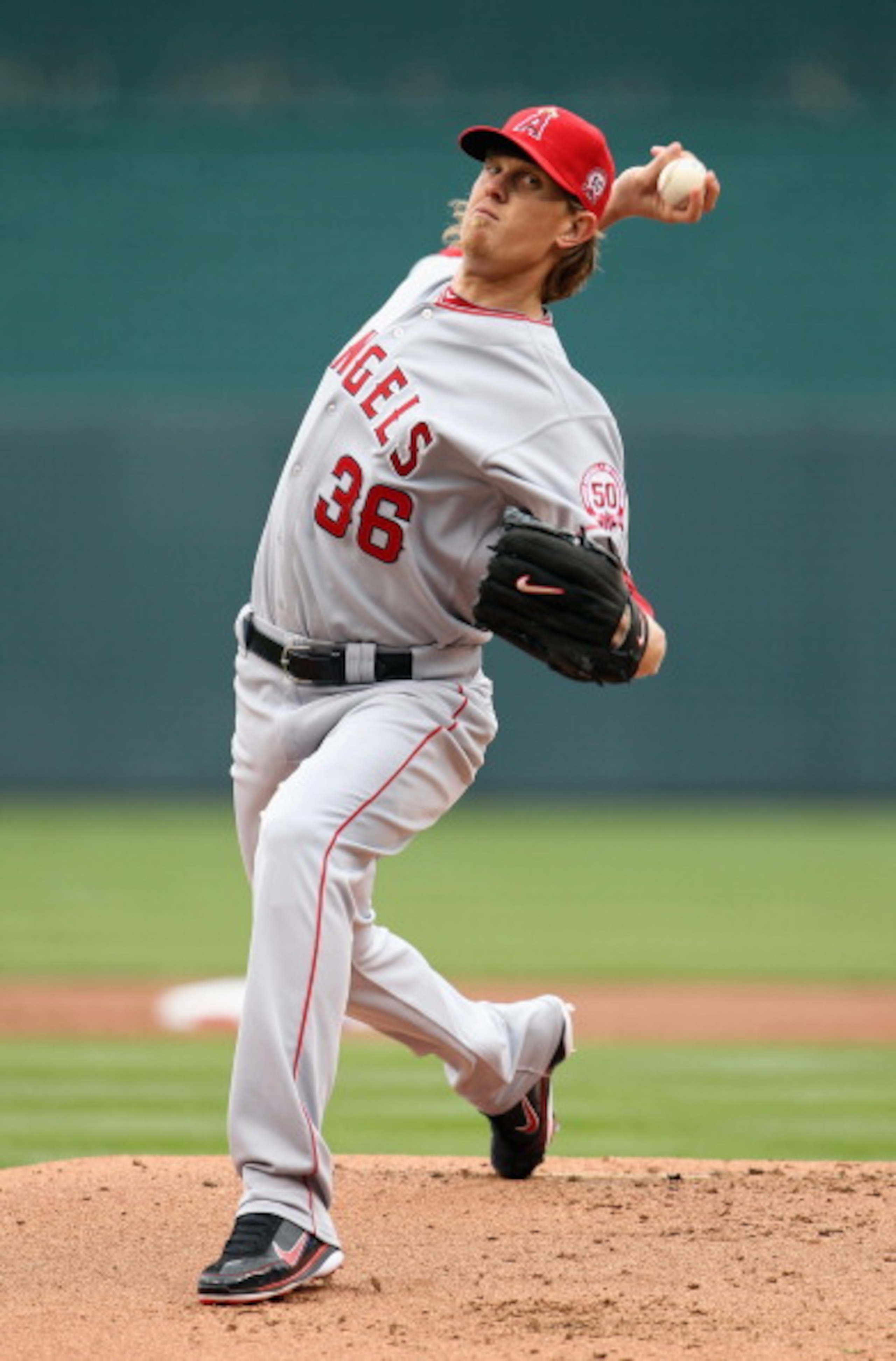 KANSAS CITY, MO - MARCH 31:  Starting pitcher Jered Weaver #36 of the Los Angeles Angels of Anaheim pitches during warm-ups just prior to the start of the opening day game against the Kansas City Royals at Kauffman Stadium on March 31, 2011 in Kansas City