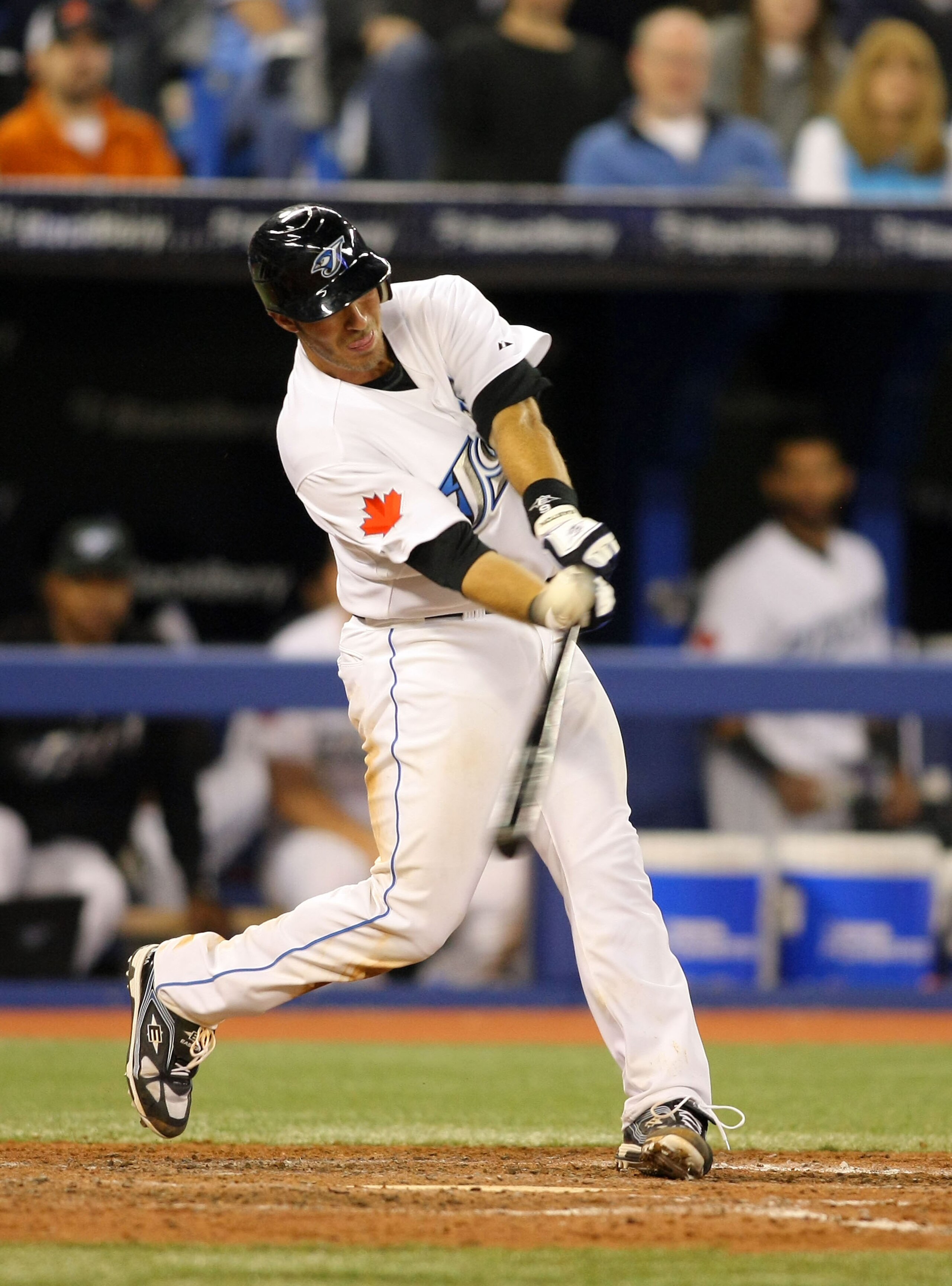 TORONTO,CANADA - APRIL 1:  J.P. Arencibia #9 of the Toronto Blue Jays hits a home run for his 5th RBI of the game against the Minnesota Twins on opening day during their MLB game at the Rogers Centre April 1, 2011 in Toronto, Ontario, Canada.(Photo By Dav