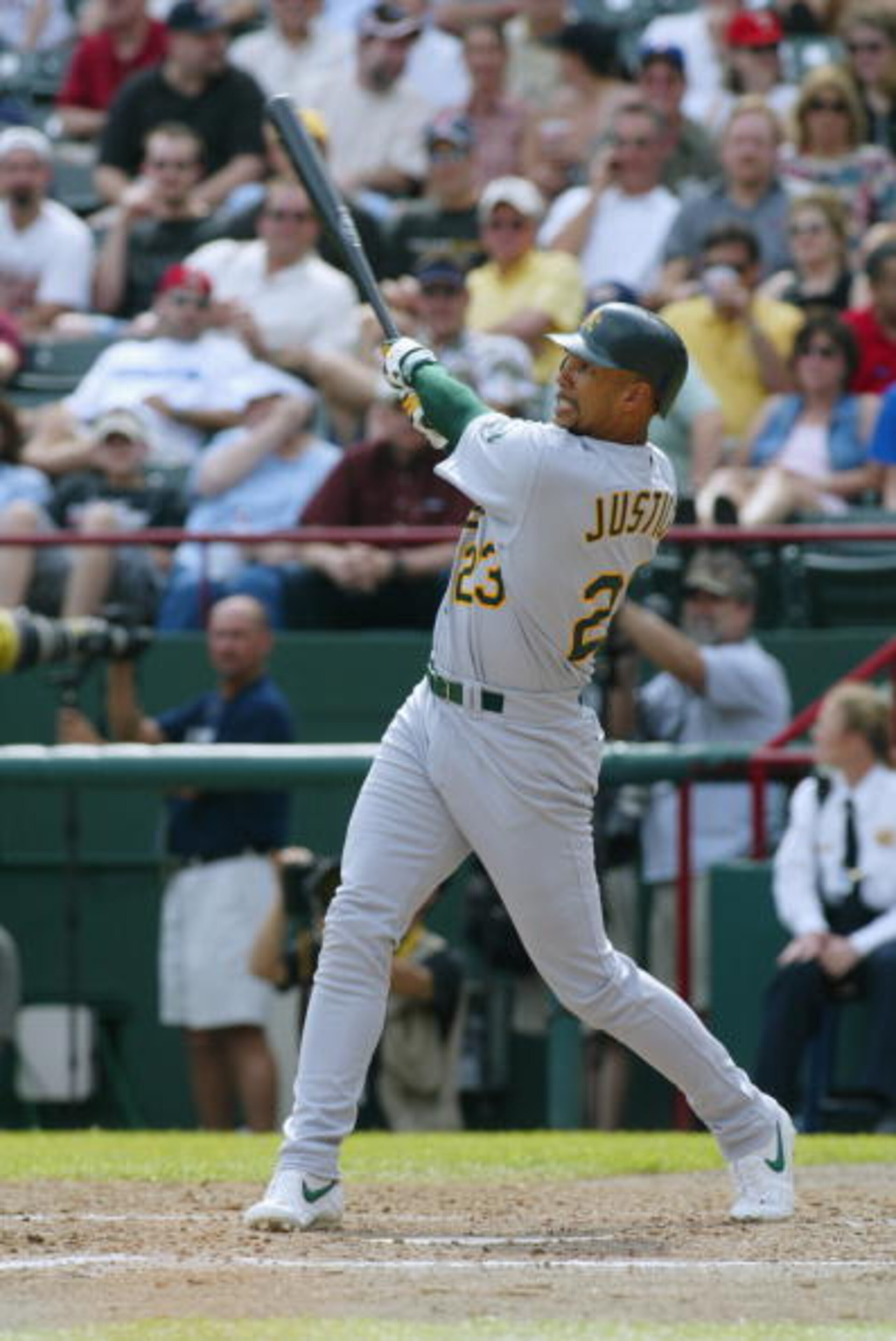 ARLINGTON, TEXAS - APRIL 11: Right fielder David Justice #23 of the Oakland Athletics watches the flight of the ball during the MLB game against the Texas Rangers at The Ballpark in Arlington, Texas on April 11, 2002. The Rangers won 7-0. (Photo by Ronal ARLINGTON, TEXAS - APRIL 11: Right fielder David Justice #23 of the Oakland Athletics watches the flight of the ball during the MLB game against the Texas Rangers at The Ballpark in Arlington, Texas on April 11, 2002. The Rangers won 7-0. (Photo by Ronal