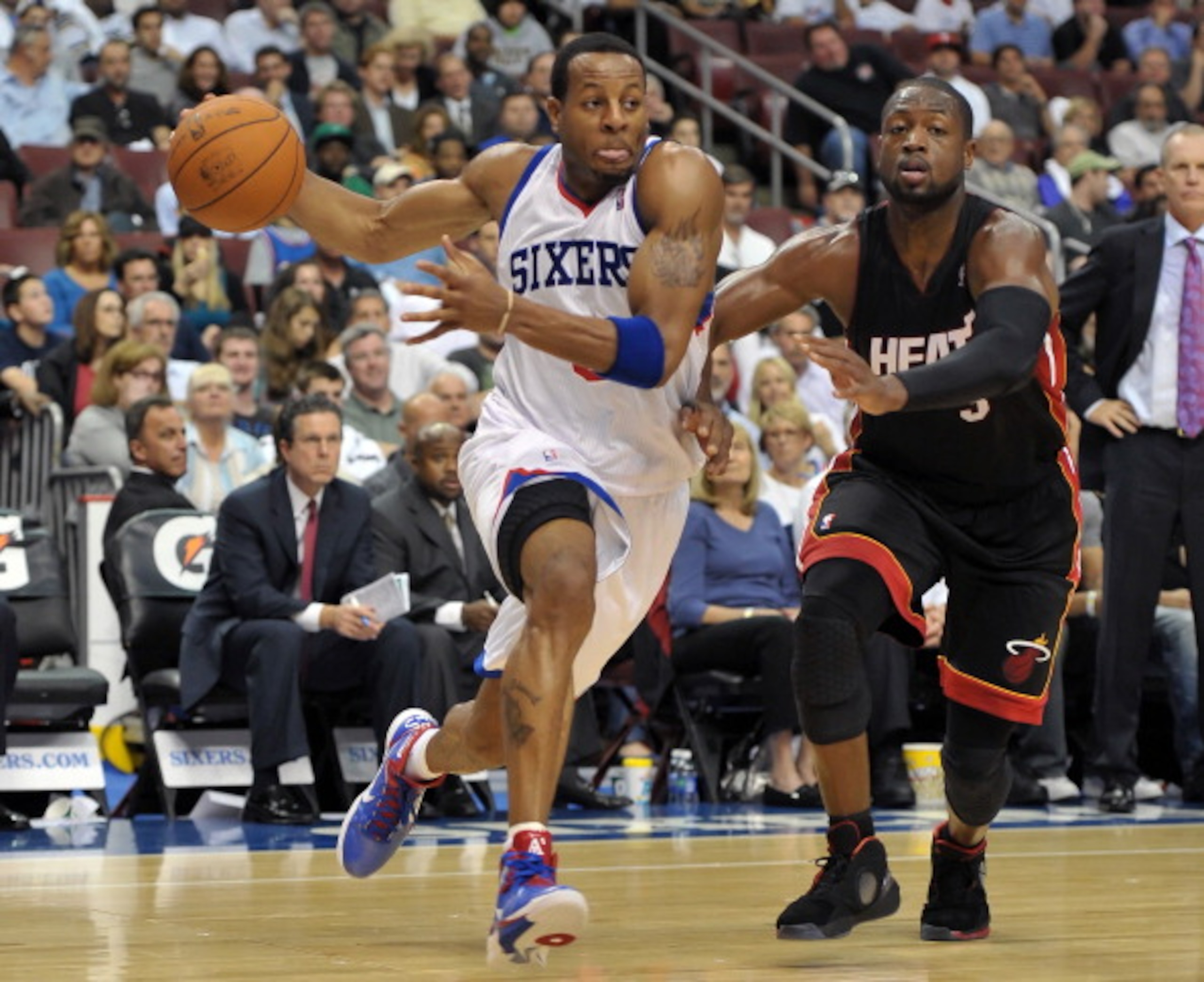 PHILADELPHIA - OCTOBER 27: Andre Iguodala #9 of the Philadelphia 76ers drives past Dwyane Wade #3 of the Miami Heat at the Wells Fargo Center on October 27, 2010 in Philadelphia, Pennsylvania. NOTE TO USER: User expressly acknowledges and agrees that, by PHILADELPHIA - OCTOBER 27: Andre Iguodala #9 of the Philadelphia 76ers drives past Dwyane Wade #3 of the Miami Heat at the Wells Fargo Center on October 27, 2010 in Philadelphia, Pennsylvania. NOTE TO USER: User expressly acknowledges and agrees that, by