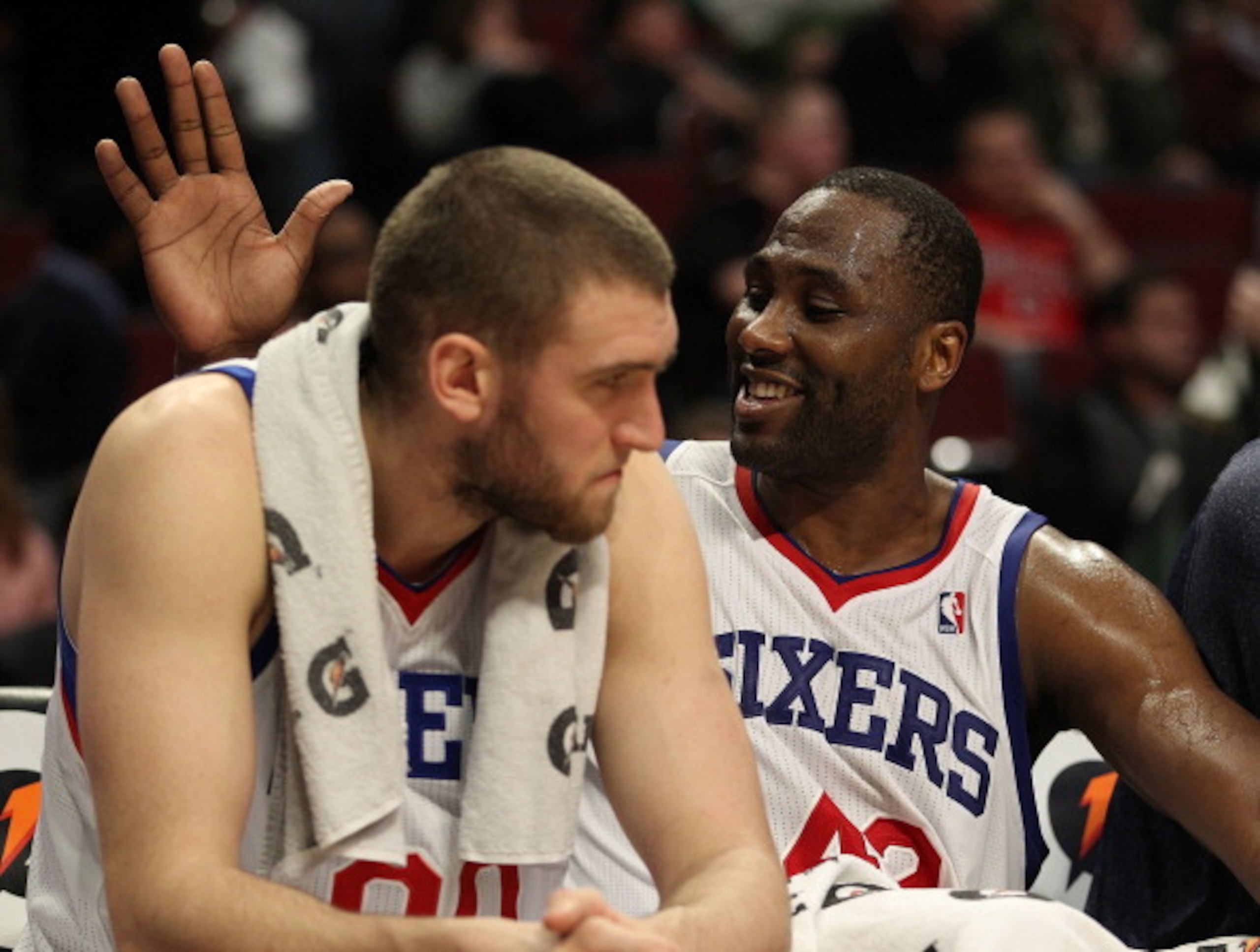 CHICAGO, IL - MARCH 28: Elton Brand #42 of the Philadelphia 76ers slaps teammate Spencer Hawes #00 on the back at the end of a win over the Chicago Bulls at the United Center on March 28, 2011 in Chicago, Illinois. The 76ers defeated the Bulls 97-85. NOTE CHICAGO, IL - MARCH 28: Elton Brand #42 of the Philadelphia 76ers slaps teammate Spencer Hawes #00 on the back at the end of a win over the Chicago Bulls at the United Center on March 28, 2011 in Chicago, Illinois. The 76ers defeated the Bulls 97-85. NOTE