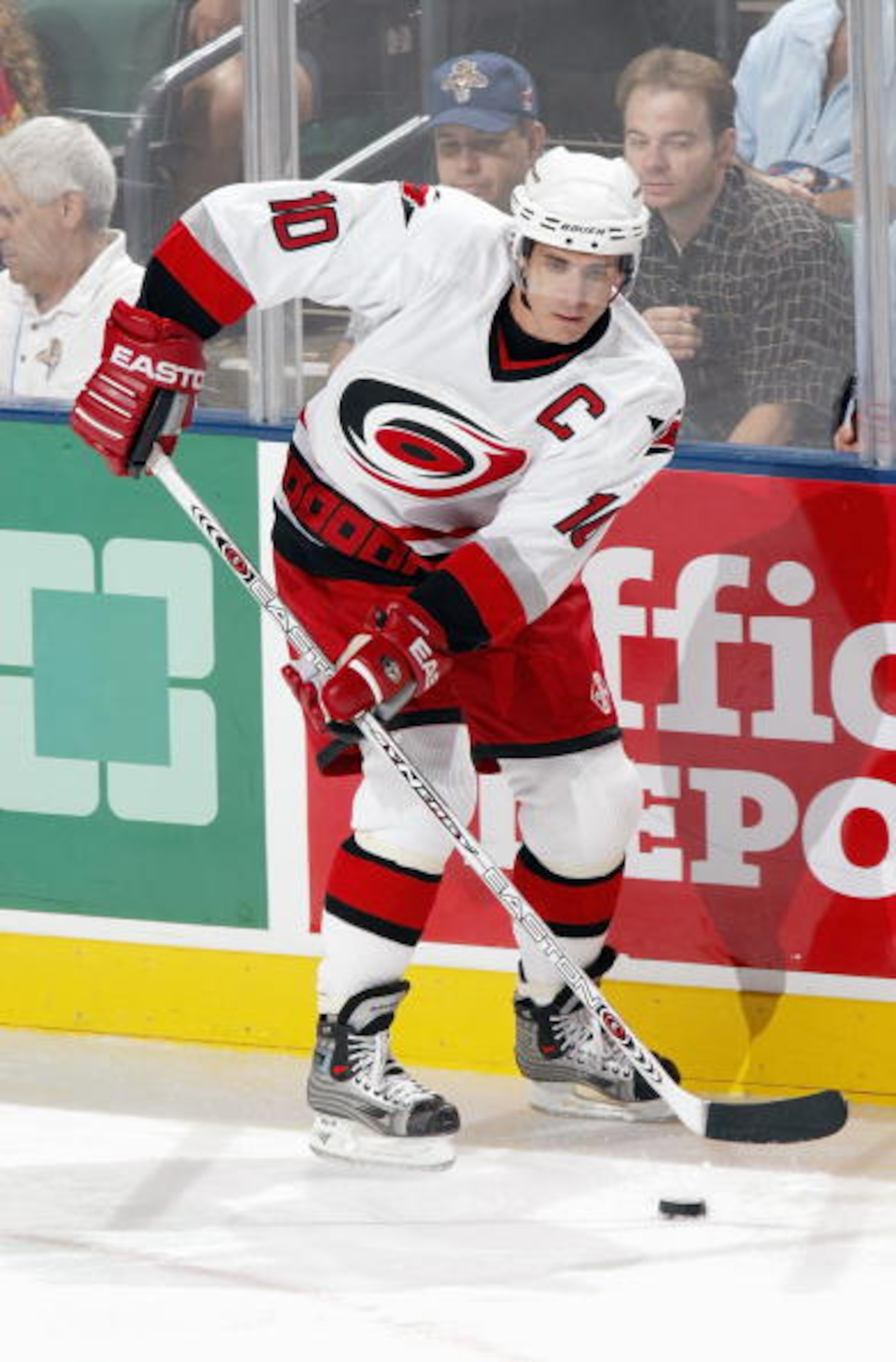 SUNRISE, FL - OCTOBER 9:  Center Ron Francis #10 of the Carolina Hurricanes plays the puck near the boards during the game against the Florida Panthers on October 9, 2003 at the Office Depot Center in Sunrise, Florida.  The Panthers defeated the Hurricane