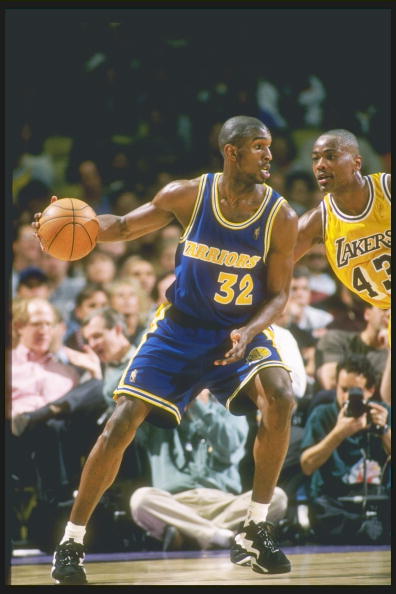 12 Mar 1997: Forward Joe Smith of the Golden State Warriors tries to fend off forward Corie Blount of the Los Angeles Lakers at the Great Western Forum in Inglewood, California. The Lakers won the game 109-101.