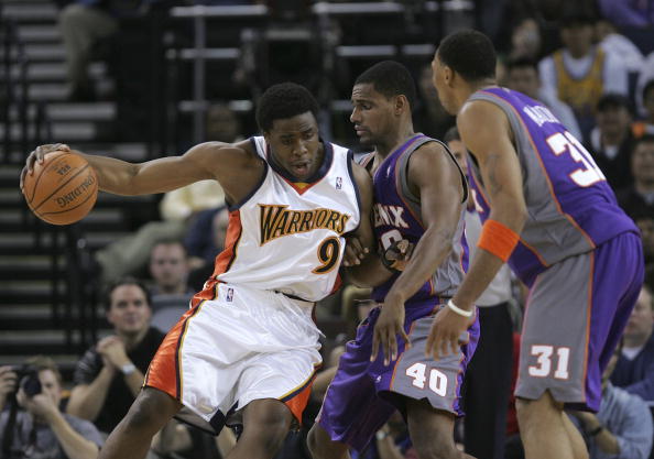 OAKLAND, CA - DECEMBER 07:  Ike Diogu #9 of the Golden State Warriors drives the ball as Kurt Thomas #40 and Shawn Marion #31 of the Phoenix Suns defend on December 7, 2005 at the Arena in Oakland, California. NOTE TO USER: User expressly acknowledges and