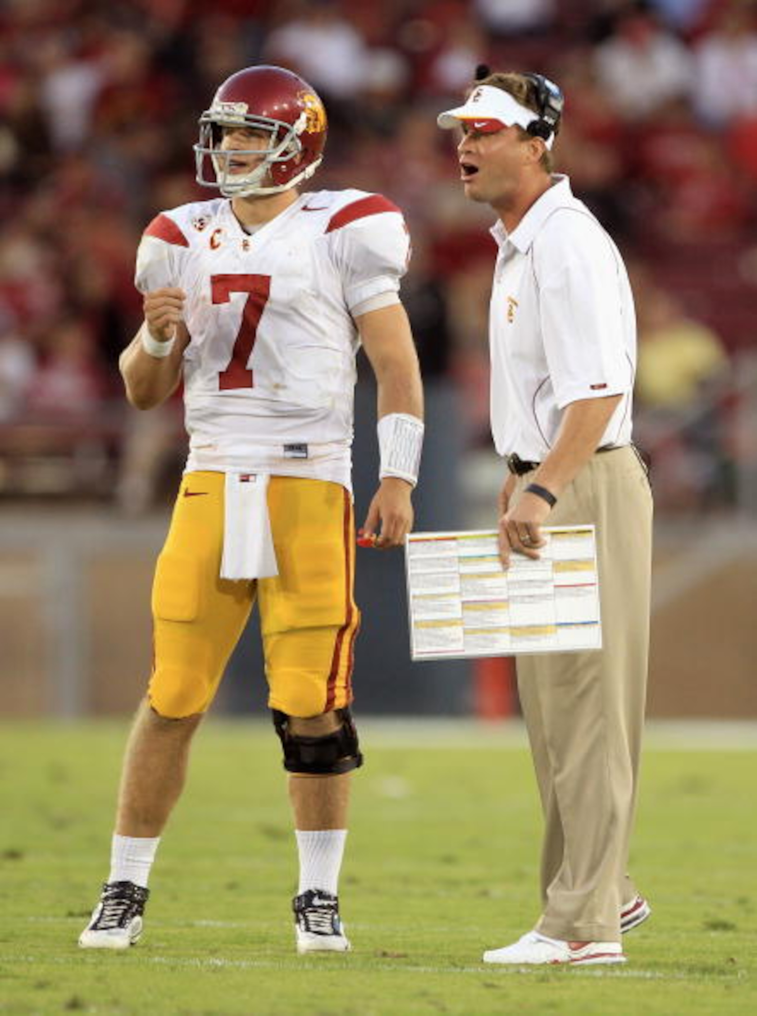 PALO ALTO, CA - OCTOBER 09:  Matt Barkley #7 of the USC Trojans speaks with head coach Lane Kiffin during their game against the Stanford Cardinal at Stanford Stadium on October 9, 2010 in Palo Alto, California.  (Photo by Ezra Shaw/Getty Images)