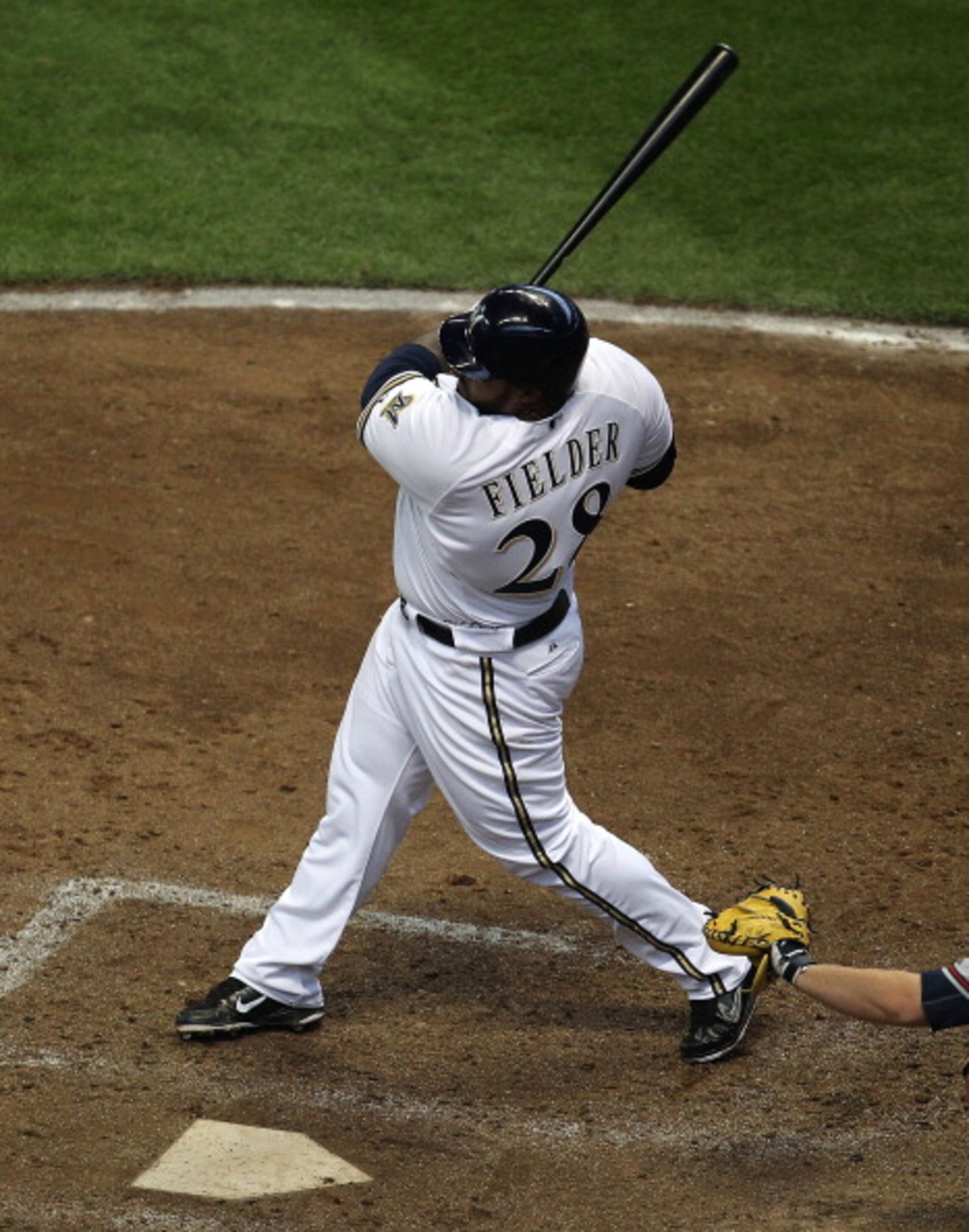 MILWAUKEE, WI - APRIL 04: Prince Fielder #28 of the Milwaukee Brewers hits the ball against the Atlanta Braves during the home opener at Miller Park on April 4, 2011 in Milwaukee, Wisconsin. The Braves defeated the Brewers 2-1. (Photo by Jonathan Daniel/G