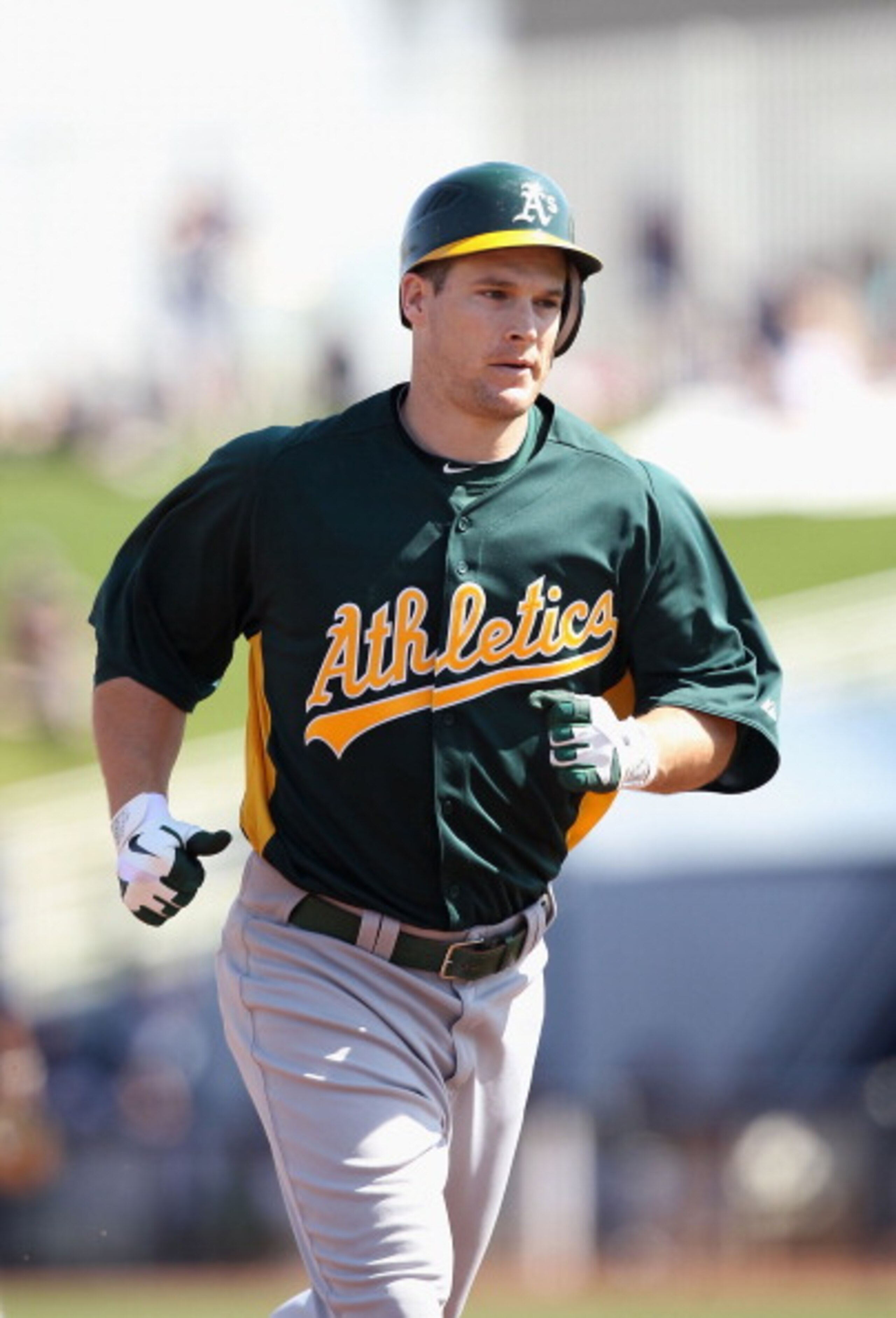 PHOENIX, AZ - MARCH 03:  Josh Willingham #16 of the Oakland Athletics rounds the bases after hitting a home run against the Milwaukee Brewers during the spring training game at Maryvale Baseball Park on March 3, 2011 in Phoenix, Arizona.  (Photo by Christ