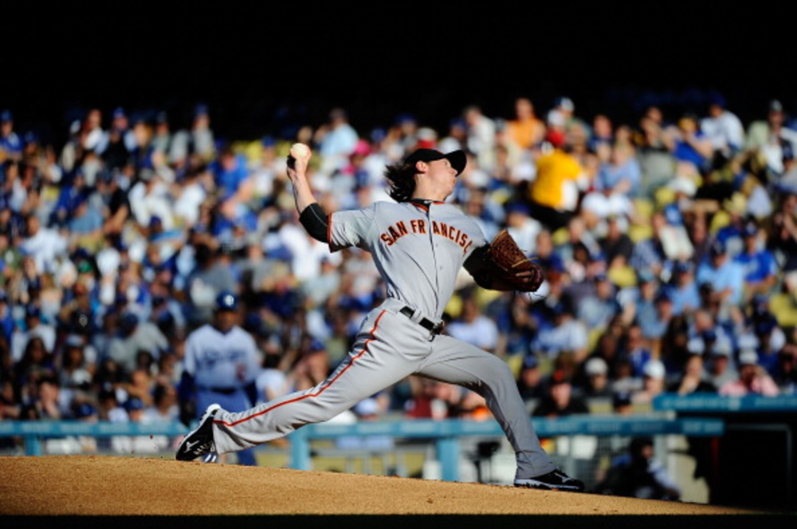 LOS ANGELES, CA - MARCH 31:  Tim Lincecum #55 of the San Francisco Giants throws a pitch against the Los Angeles Dodgers on Opening Day at Dodger Stadium on March 31, 2011 in Los Angeles, California.  (Photo by Kevork Djansezian/Getty Images)