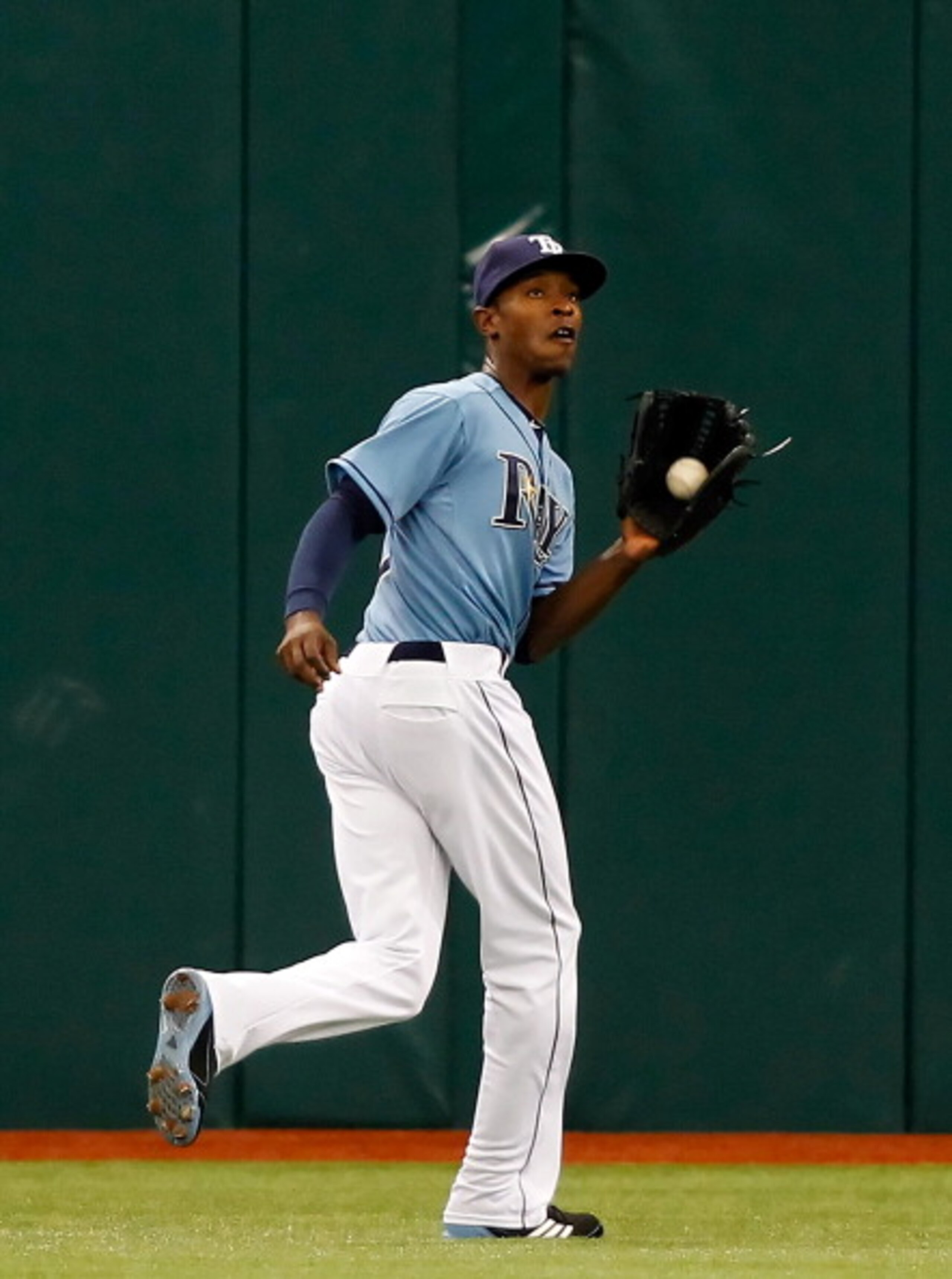 ST. PETERSBURG, FL - APRIL 03:  Outfielder B.J. Upton #2 of the Tampa Bay Rays catches a fly ball against the Baltimore Orioles during the game at Tropicana Field on April 3, 2011 in St. Petersburg, Florida.  (Photo by J. Meric/Getty Images)