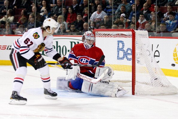 MONTREAL, CANADA - APRIL 5:  Michael Frolik #67 of the Chicago Blackhawks shoots the puck wide past Carey Price #31 of the Montreal Canadiens during the NHL game at the Bell Centre on April 5, 2011 in Montreal, Quebec, Canada.  The Canadiens defeated the