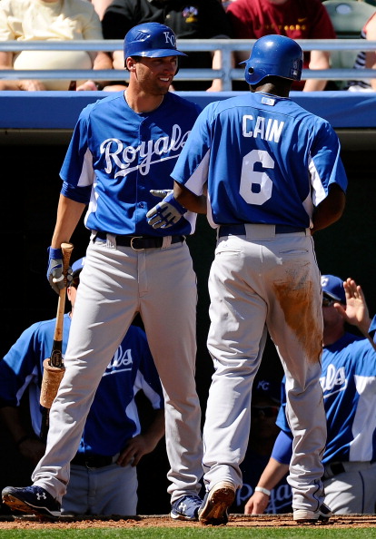 MESA, AZ - MARCH 09:  Lorenzo Cain #6 of the Kansas City Royals is congratulated by Jeff Francoeur #21 against the Chicago Cubs during the spring training baseball game at HoHoKam Stadium on March 9, 2011 in Mesa, Arizona.  (Photo by Kevork Djansezian/Get