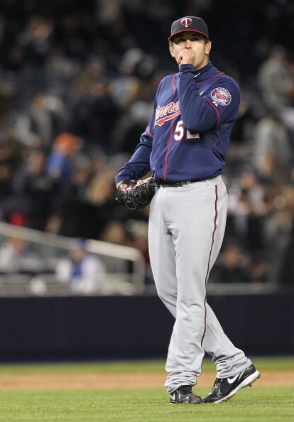 NEW YORK, NY - APRIL 05:  Brian Duensing #52 of the Minnesota Twins reacts after being hit for a homerun against the New York Yankees at Yankee Stadium on April 3, 2011 in the Bronx borough of New York City.  (Photo by Nick Laham/Getty Images)