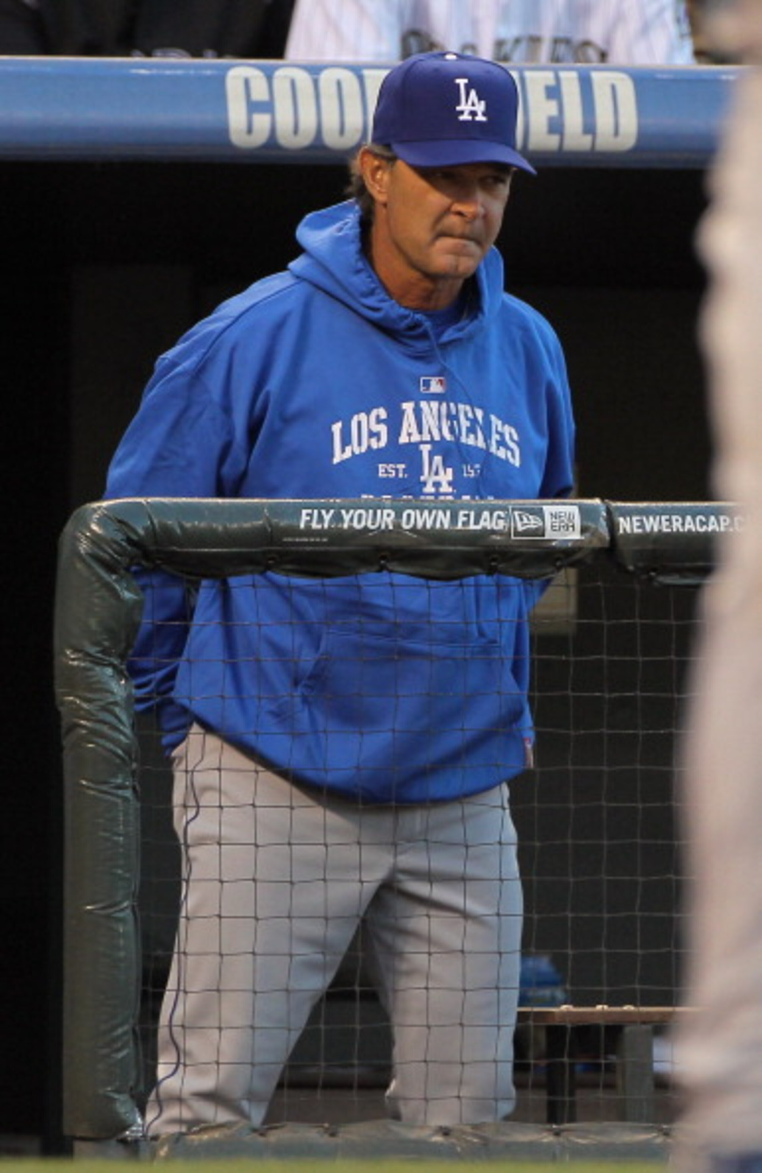 DENVER, CO - APRIL 05:  Manager Don Mattingly  of the Los Angeles Dodgers oversees the action as his team faces the Colorado Rockies at Coors Field on April 5, 2011 in Denver, Colorado. The Rockies defeated the Dodgers 3-0.  (Photo by Doug Pensinger/Getty