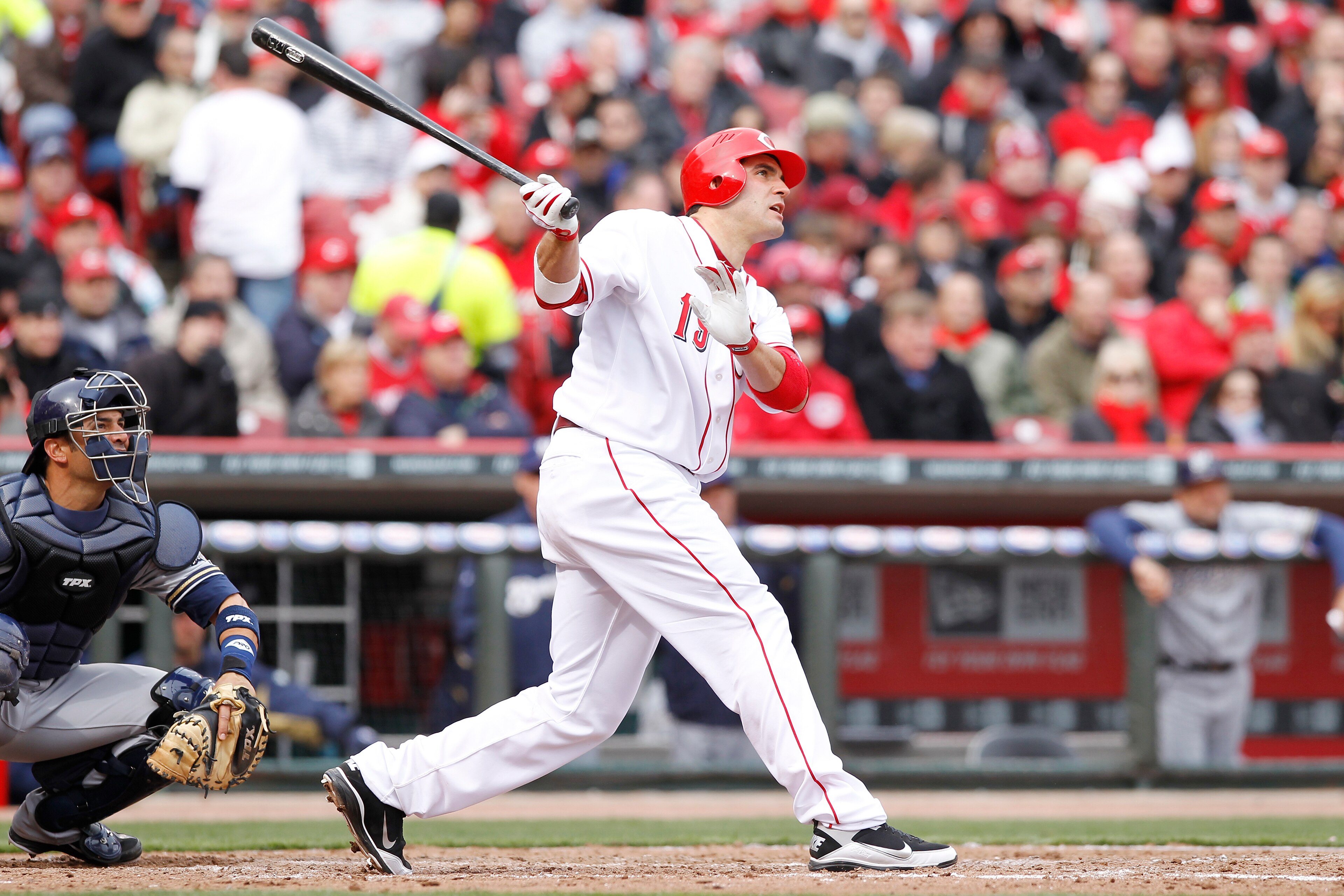 CINCINNATI, OH - MARCH 31: Joey Votto #19 of the Cincinnati Reds hits a home run in the seventh inning against the Milwaukee Brewers in the opening day game at Great American Ballpark on March 31, 2011 in Cincinnati, Ohio. The Reds won 7-6. (Photo by Joe CINCINNATI, OH - MARCH 31: Joey Votto #19 of the Cincinnati Reds hits a home run in the seventh inning against the Milwaukee Brewers in the opening day game at Great American Ballpark on March 31, 2011 in Cincinnati, Ohio. The Reds won 7-6. (Photo by Joe