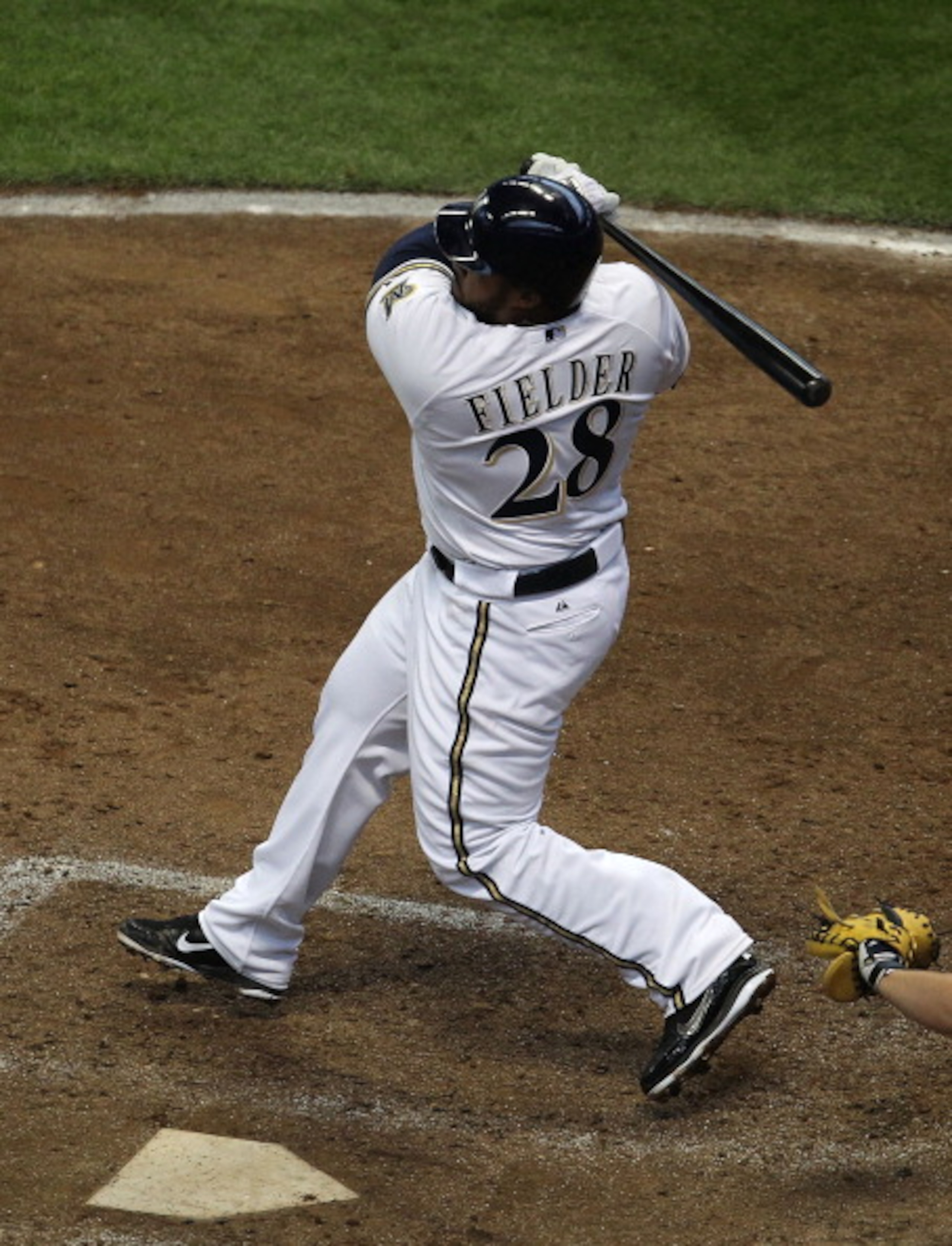 MILWAUKEE, WI - APRIL 04: Prince Fielder #28 of the Milwaukee Brewers hits the ball against the Atlanta Braves during the home opener at Miller Park on April 4, 2011 in Milwaukee, Wisconsin. The Braves defeated the Brewers 2-1. (Photo by Jonathan Daniel/G