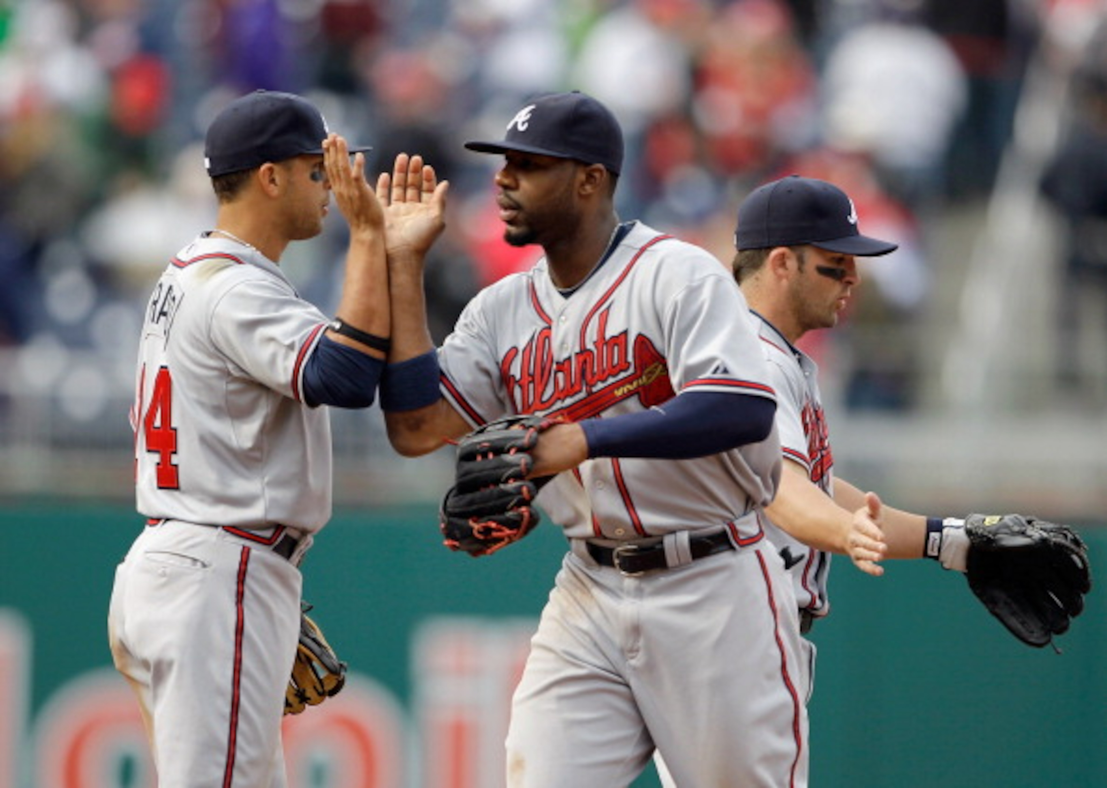 WASHINGTON, DC - APRIL 03: Martin Prado #14 of the Atlanta Braves and teammate Jason Heyward #22 celebrate after they defeated the Washington Nationals 11-2 at Nationals Park on April 3, 2011 in Washington, DC. (Photo by Rob Carr/Getty Images) WASHINGTON, DC - APRIL 03: Martin Prado #14 of the Atlanta Braves and teammate Jason Heyward #22 celebrate after they defeated the Washington Nationals 11-2 at Nationals Park on April 3, 2011 in Washington, DC. (Photo by Rob Carr/Getty Images)